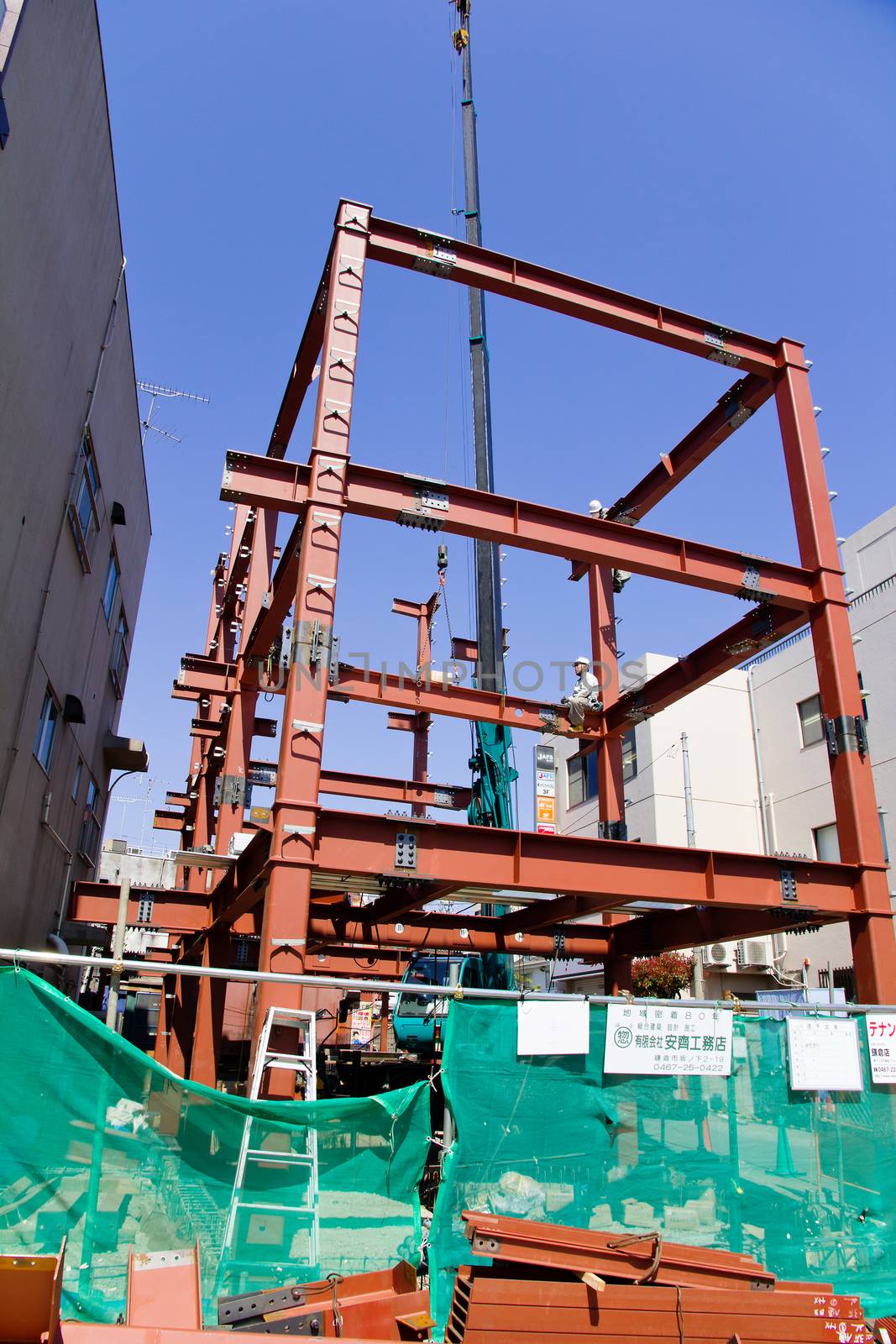 TOKYO, JAPAN- APRIL 14, 2014: Construction site in Tokyo, Foreman and builder working on construction site Tokyo, Japan. April 14 2014