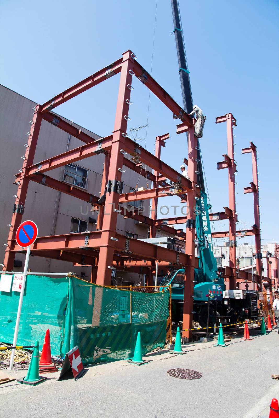 TOKYO, JAPAN- APRIL 14, 2014: Construction site in Tokyo, Foreman and builder working on construction site Tokyo, Japan. April 14 2014