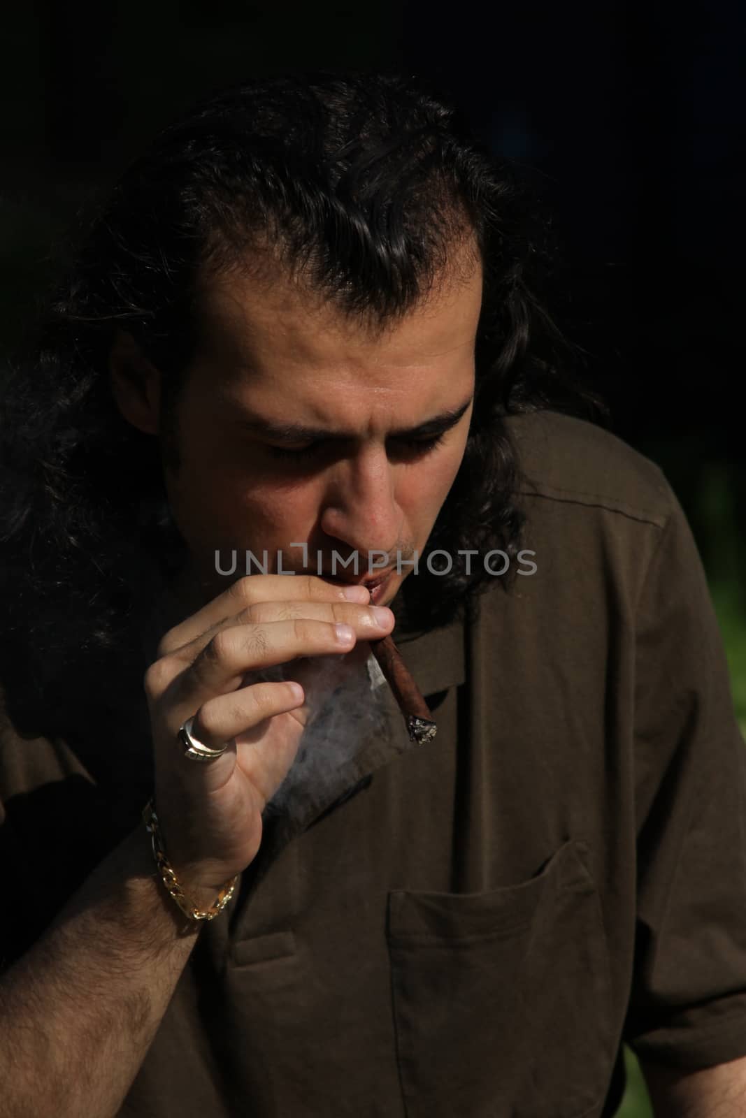 Person Smoking a Cigar by MichaelFelix