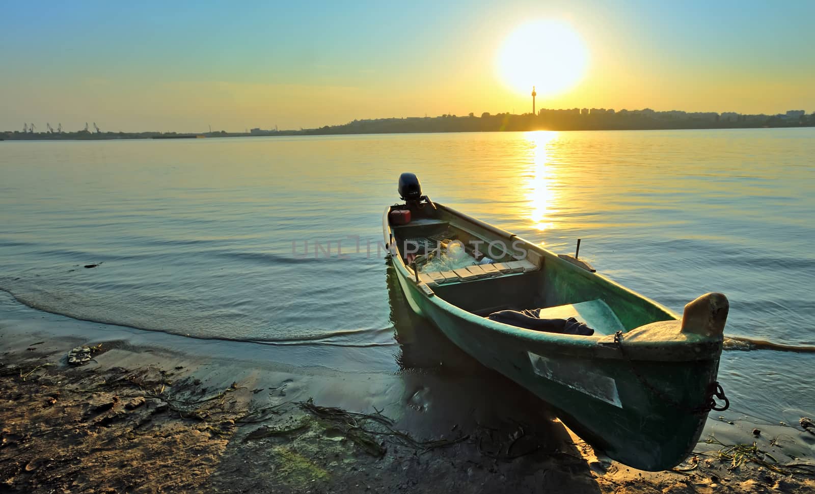 Fishing boat on the shore of Danube, at sunset