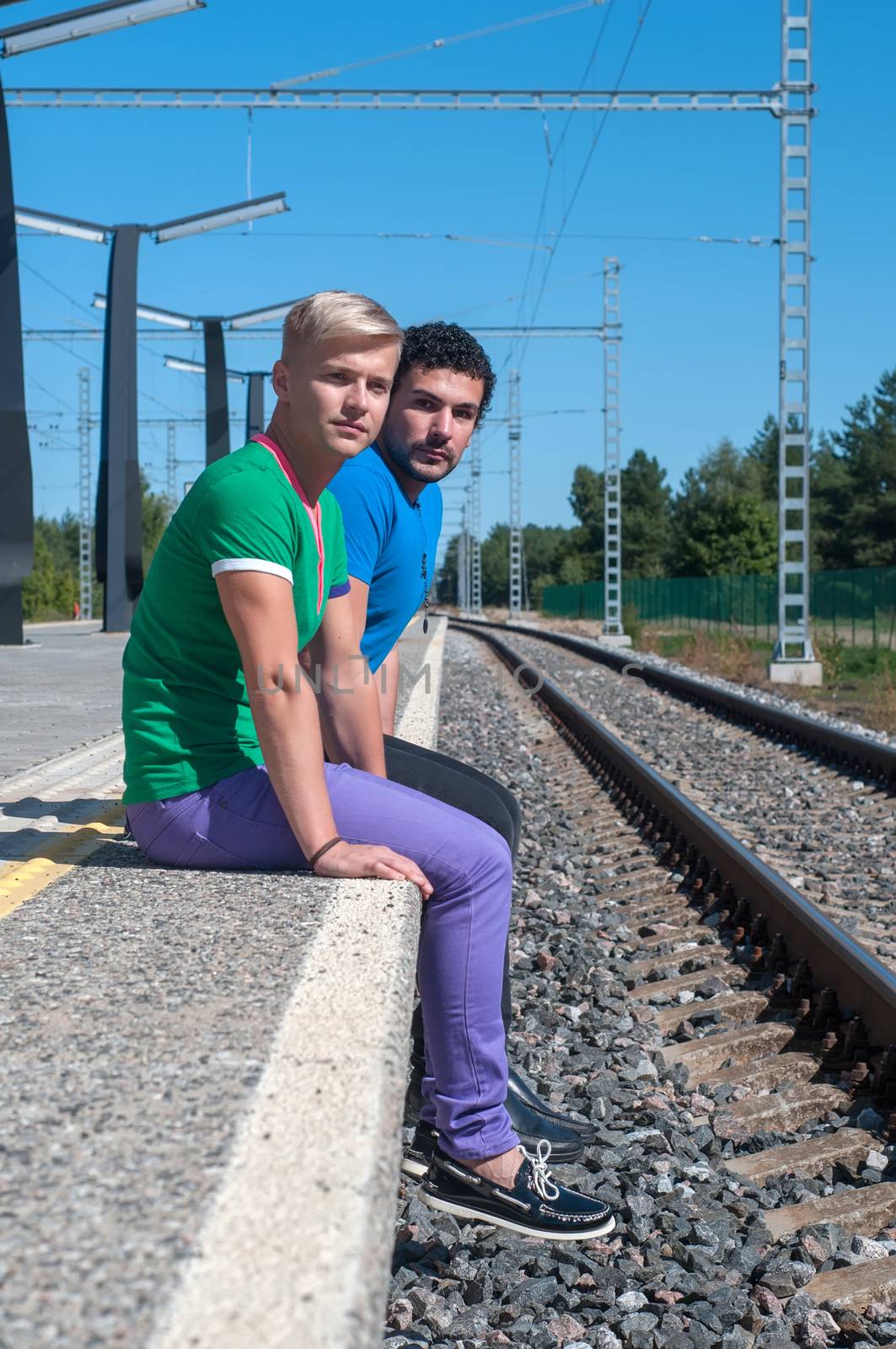 Two young men sitting on the platform by anytka