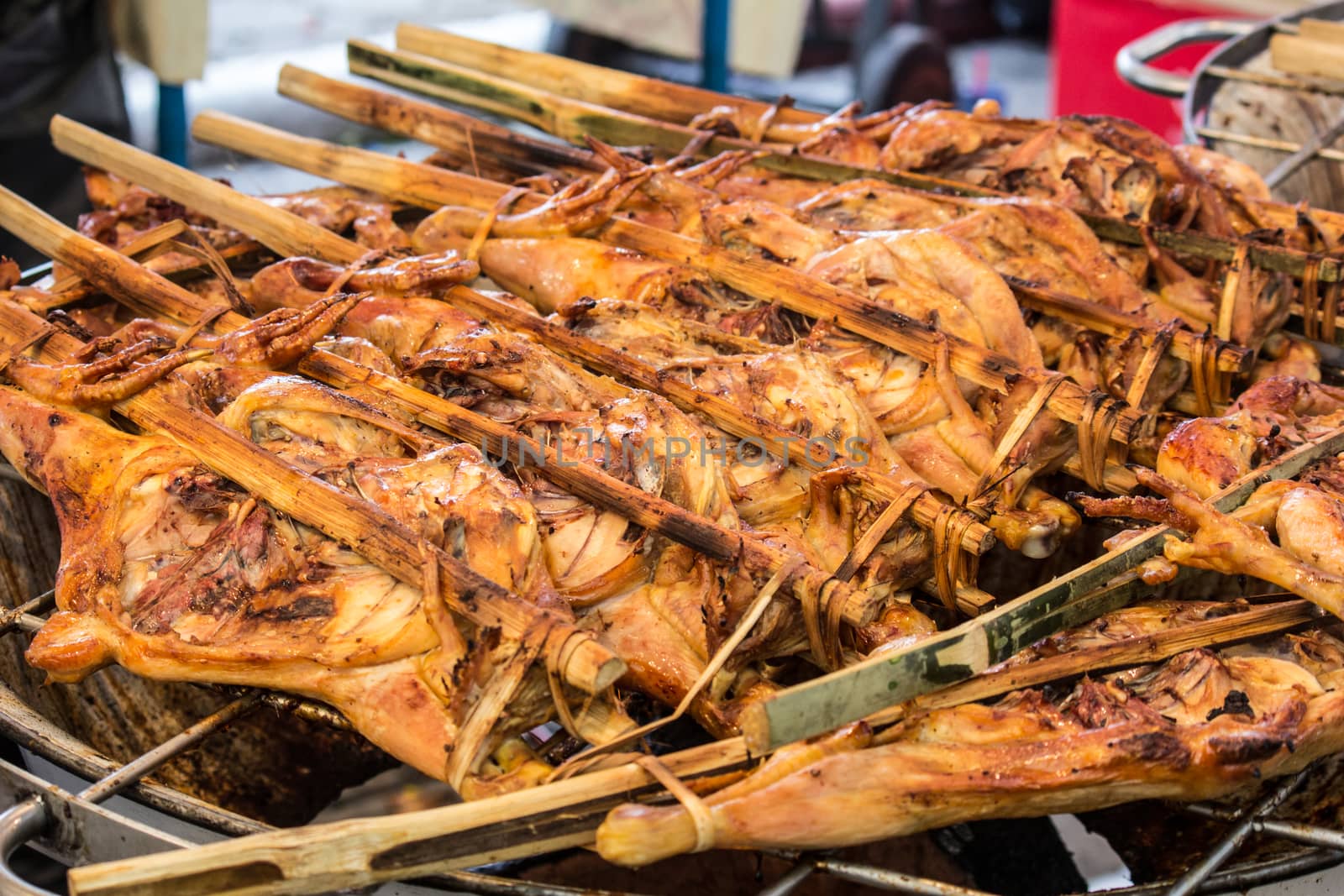 grilled chicken sold by street food vendor by redthirteen