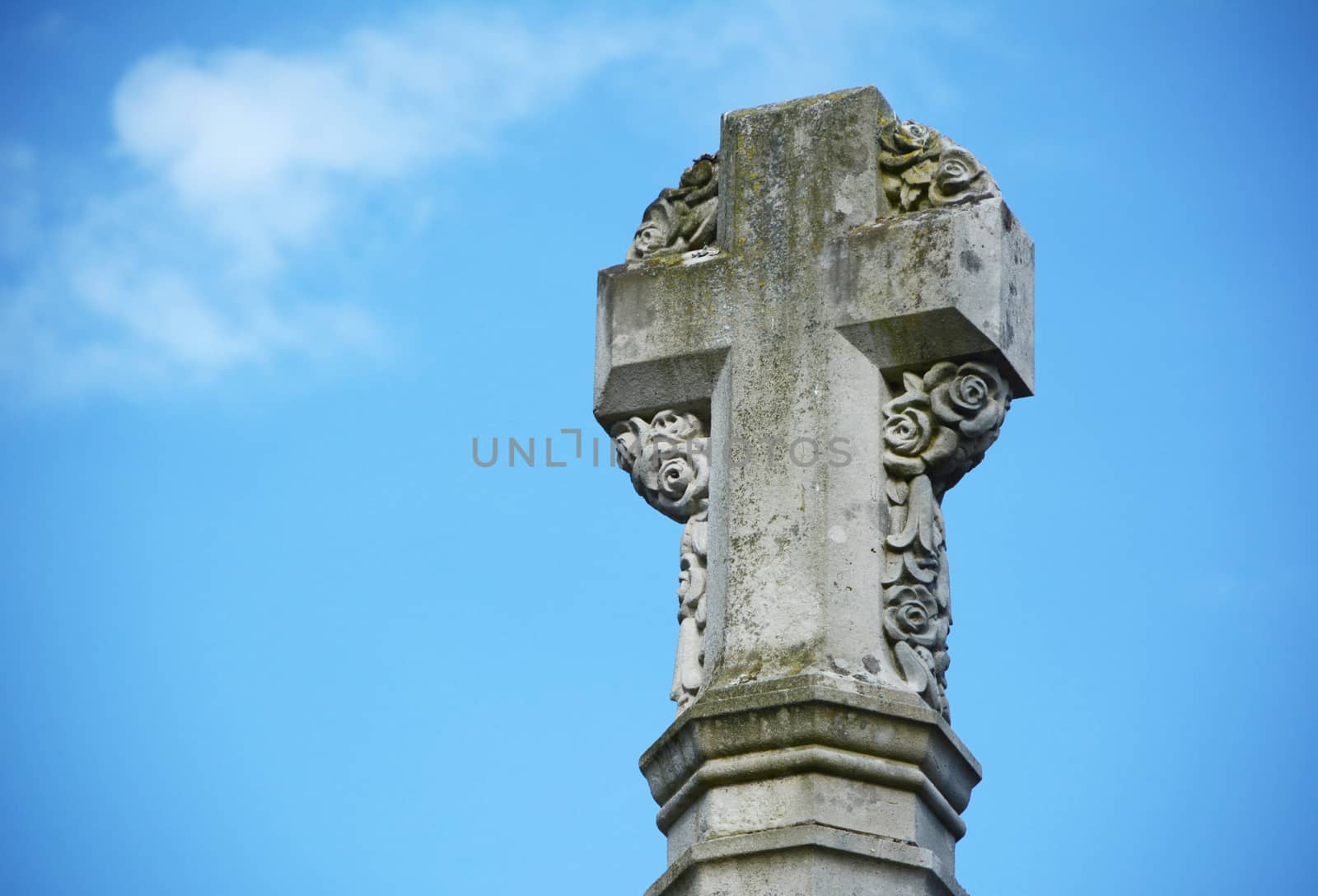 Detail of stone cross war memorial outside Winchester Cathedral, England