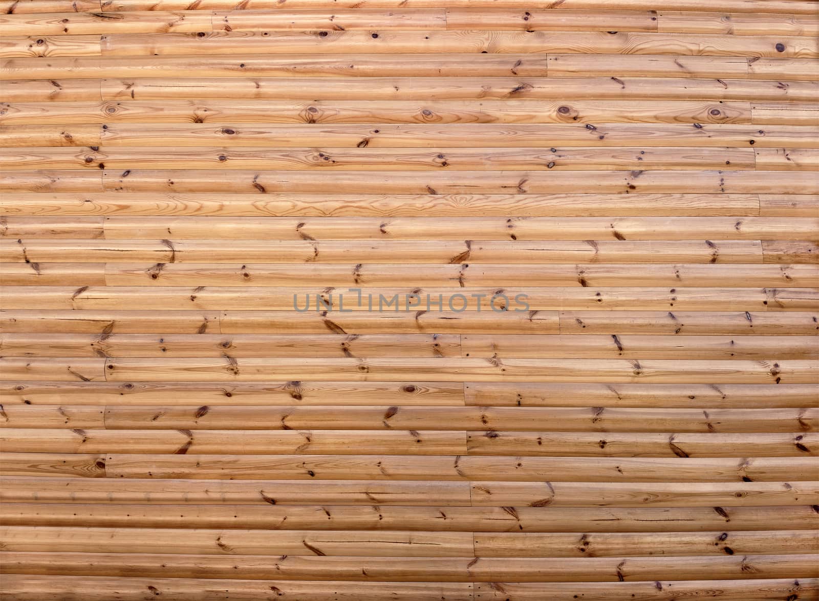 Detail of a house wall, lined with wooden building blocks-block house, lacquered