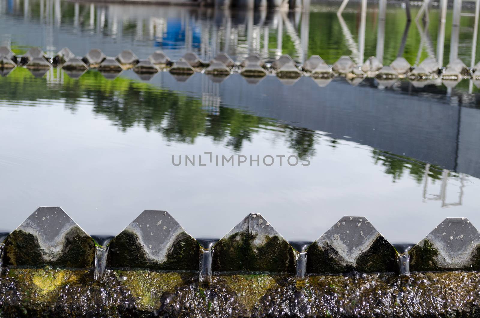 Closeup of last sewage waste water treatment stage filtration sedimentation. Drinkable water flow.