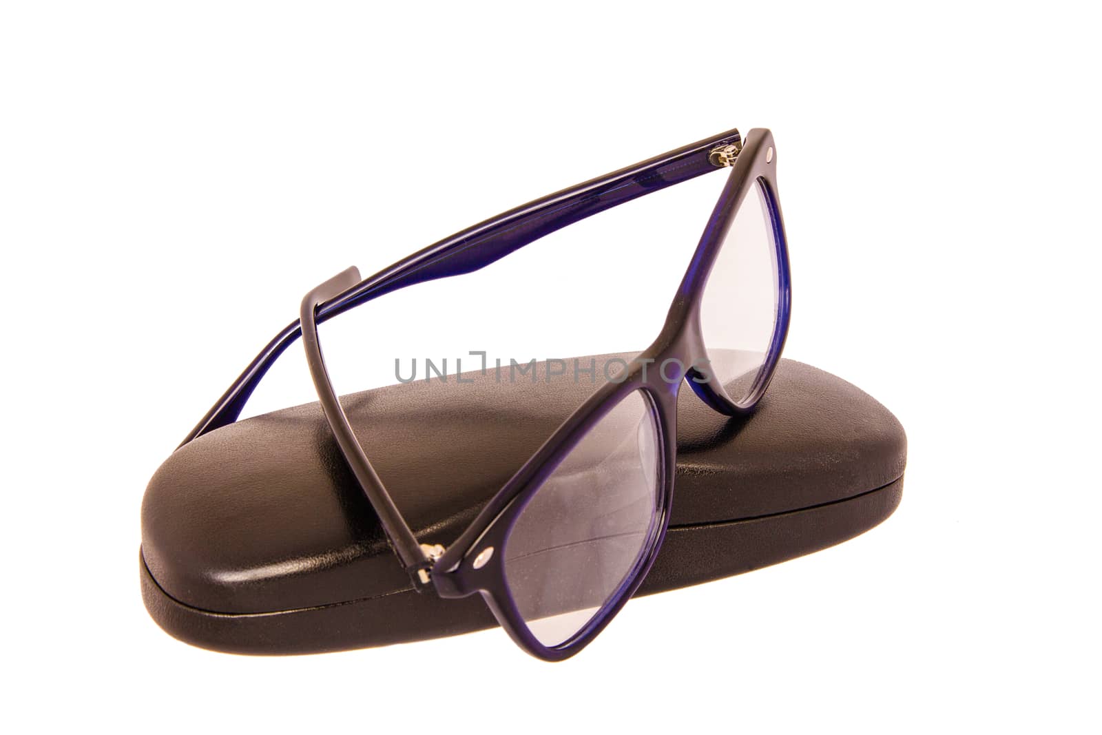 Close-up of eyeglasses with case on a white background