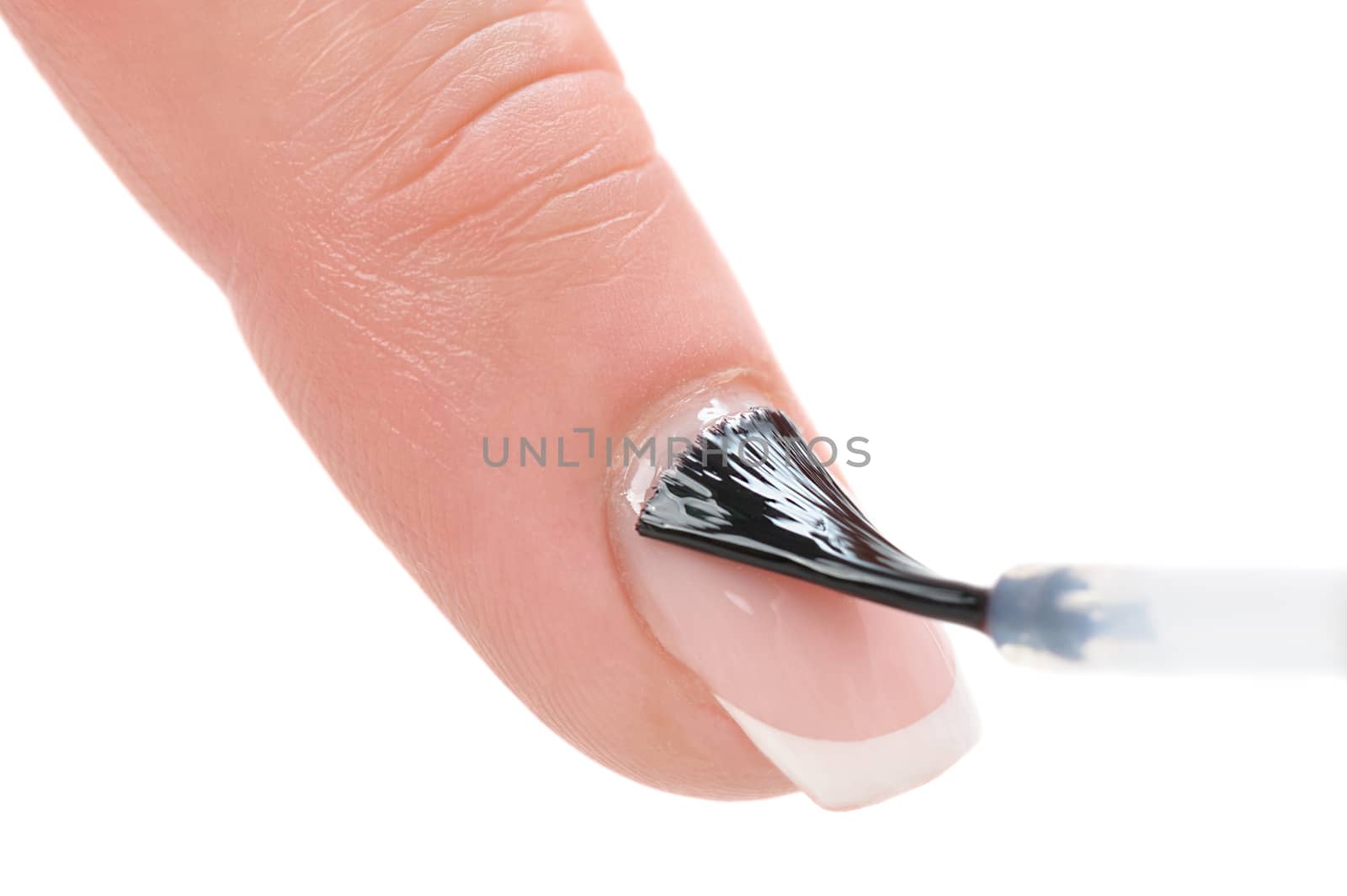 manicure applying, brushing fingernails with clear enamel