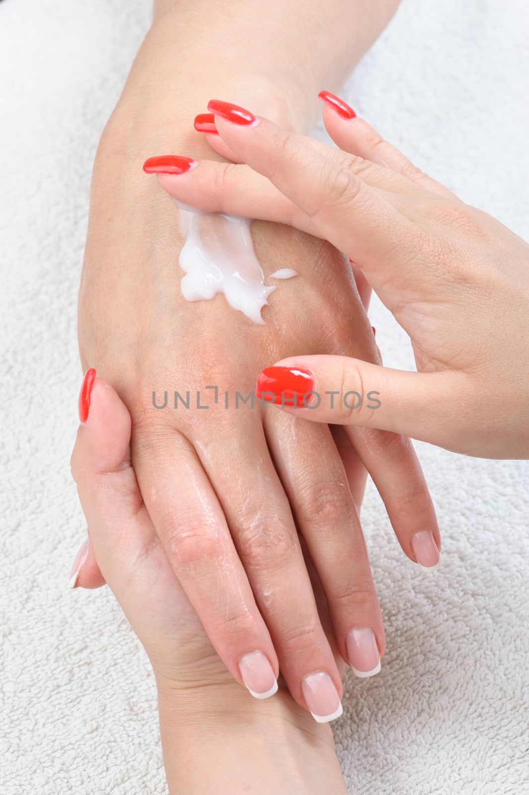 beauty salon, hands massage with moisturizing cream by starush