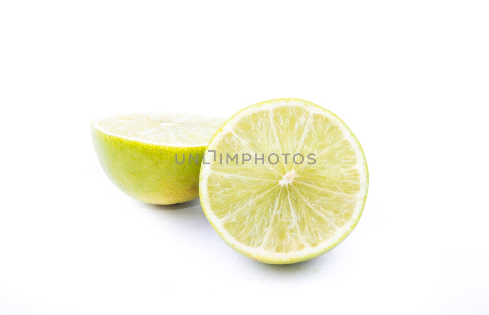 the cut of beautiful green lemon lime on the white background