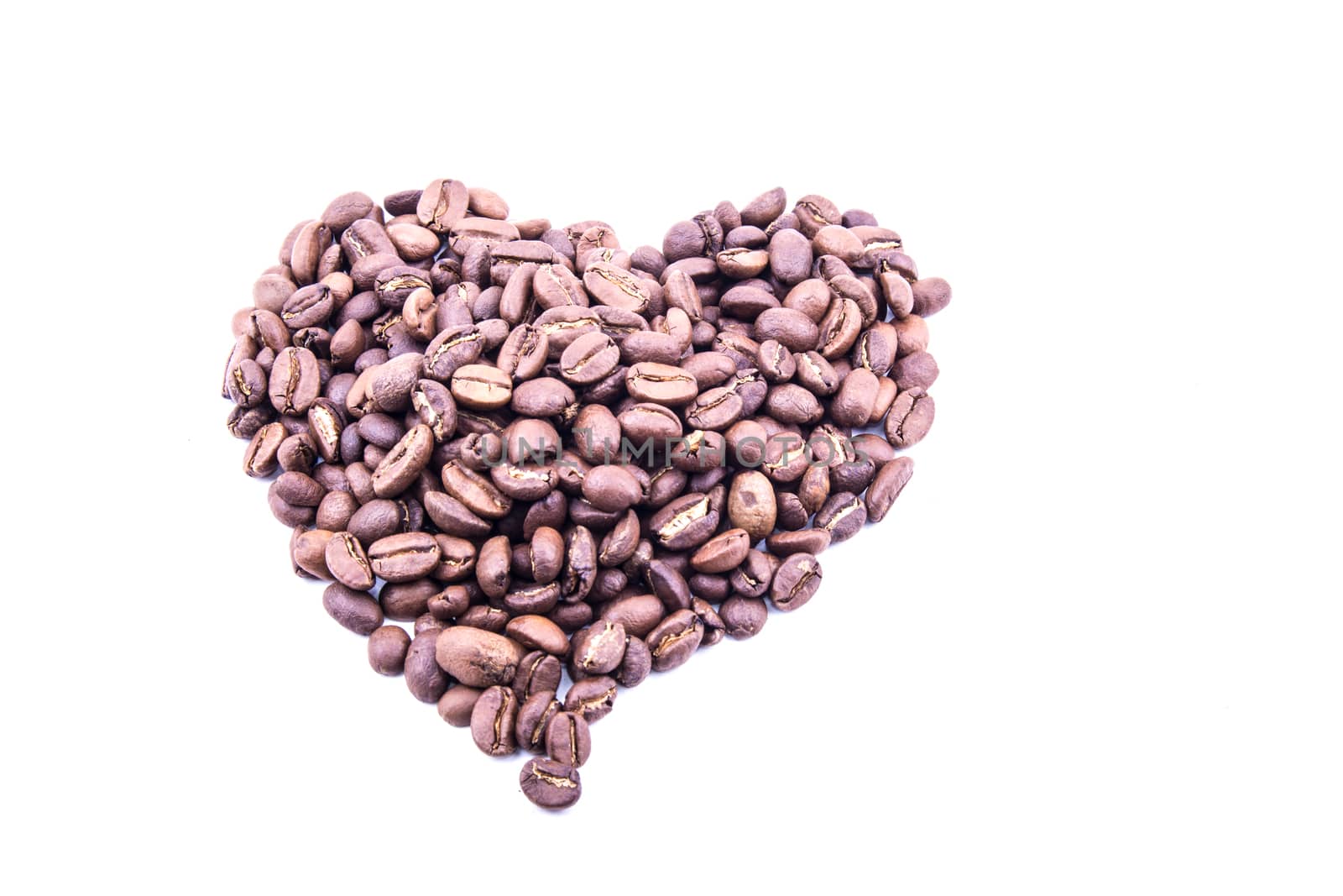 the isolated heart coffee beans on the white background ideal for wallpaper and others