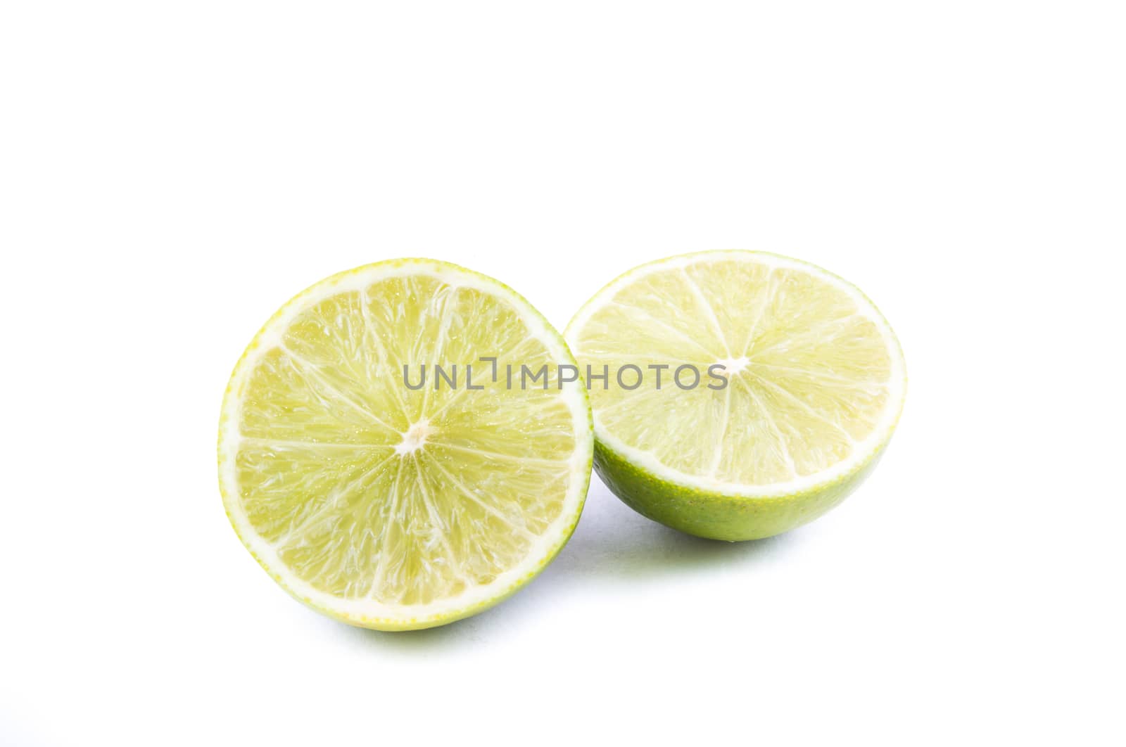 the cut of beautiful green lemon lime on the white background