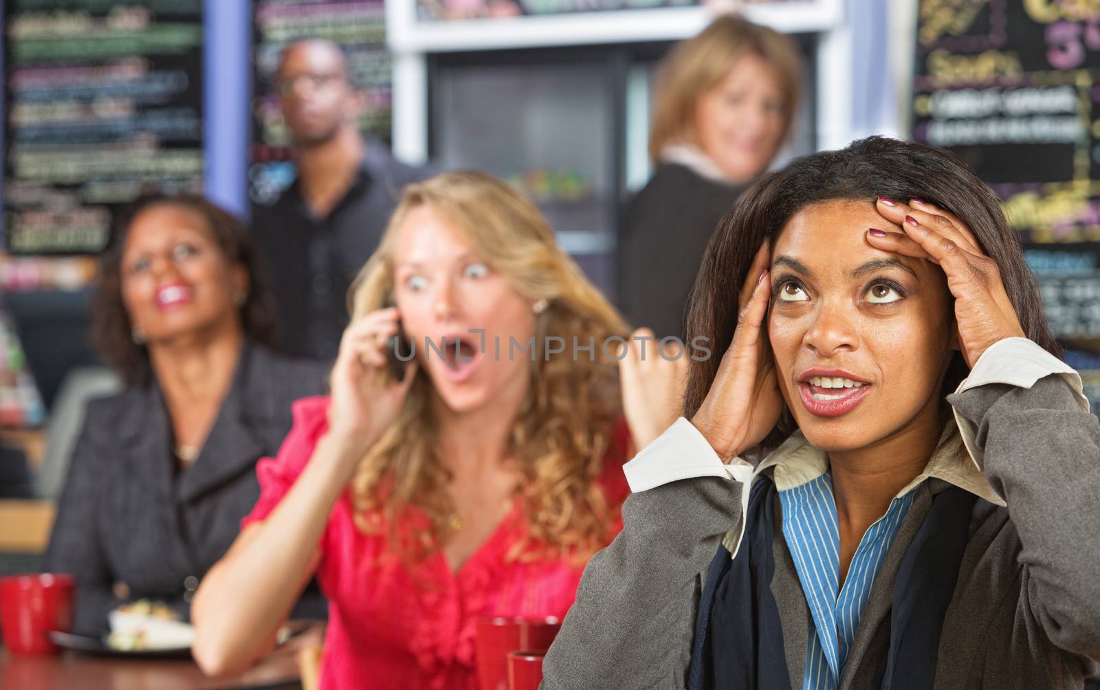 Annoyed lady listening to obnoxious woman on phone