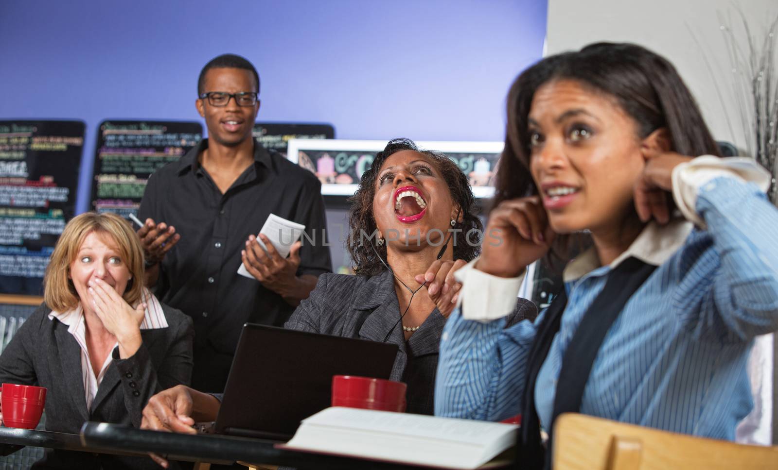 Business woman singing and annoying customers in cafe