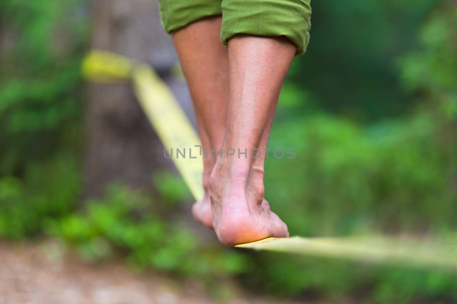 Slack line in the nature. by kasto