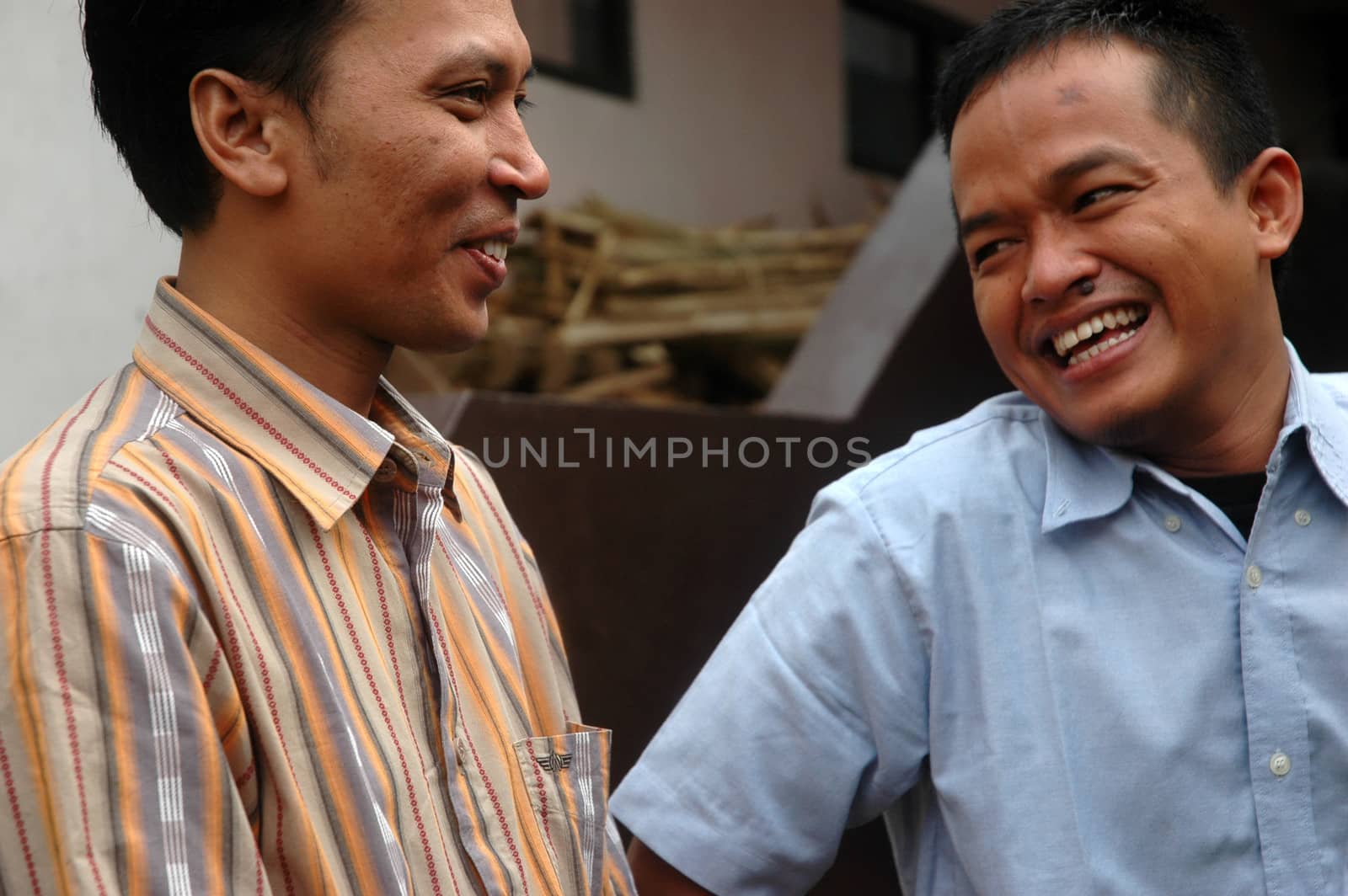cikijing, west java, indonesia - july 10, 2011: expression of man laughing