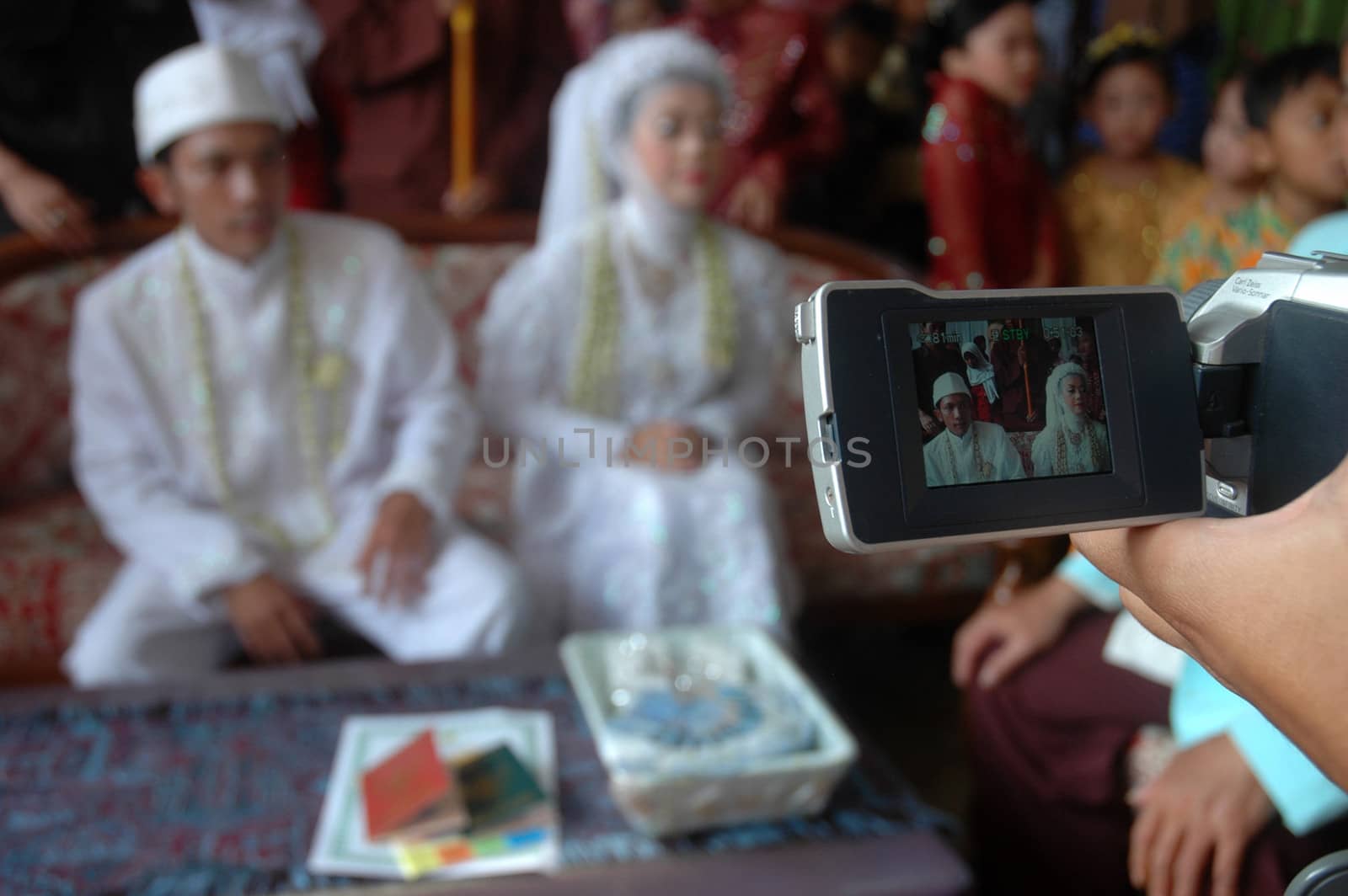 cikijing, west java, indonesia - july 10, 2011: bride and groom wearing traditional west java wedding costume