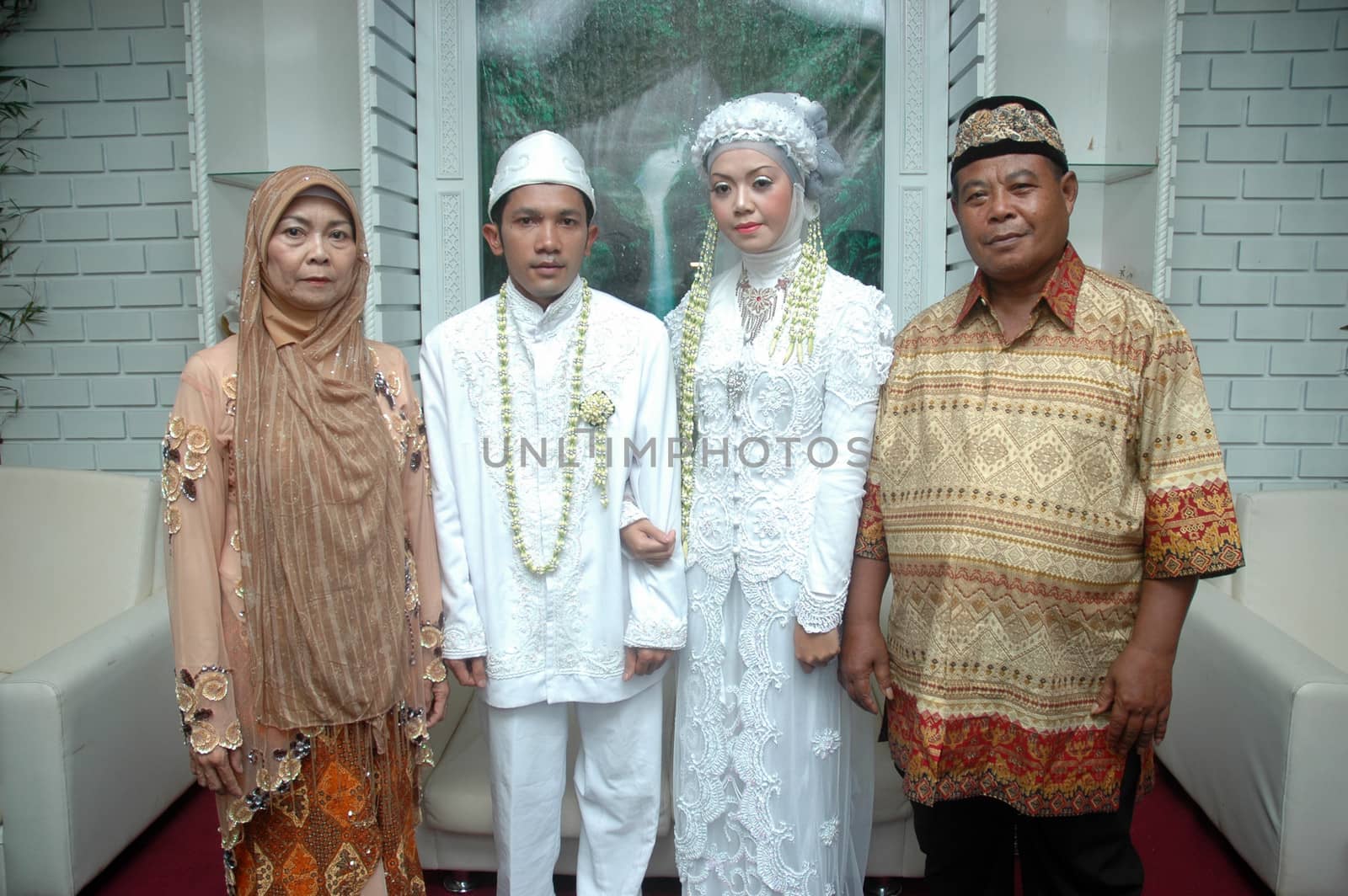 cikijing, west java, indonesia - july 10, 2011: bride and groom wearing traditional west java wedding costume