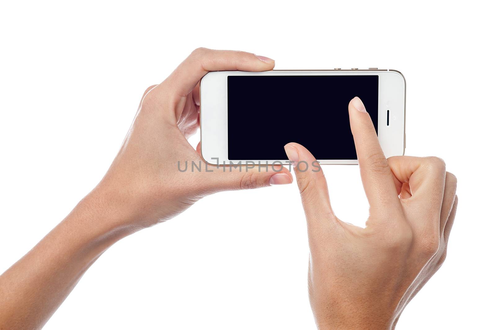Fingers zooming in on cell phone by stockyimages