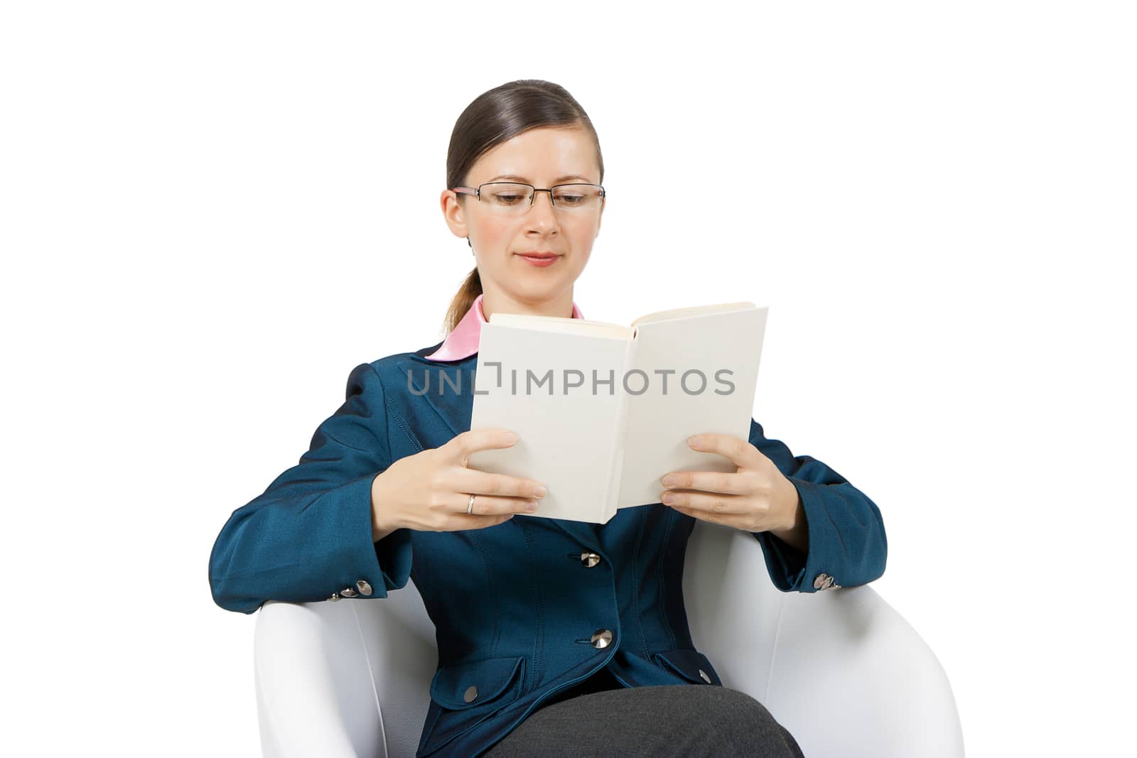 Young woman in glasses with a book and sitting in a chair