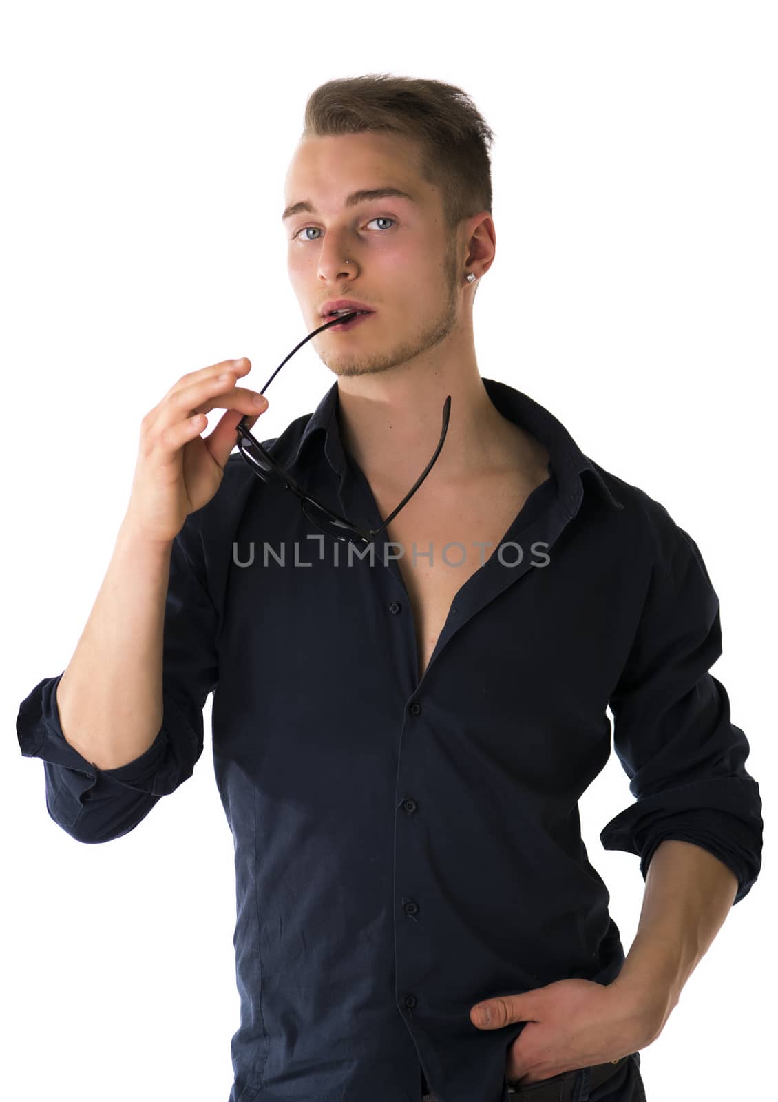 Cool confident blond young man with sunglasses and blue shirt, isolated on white