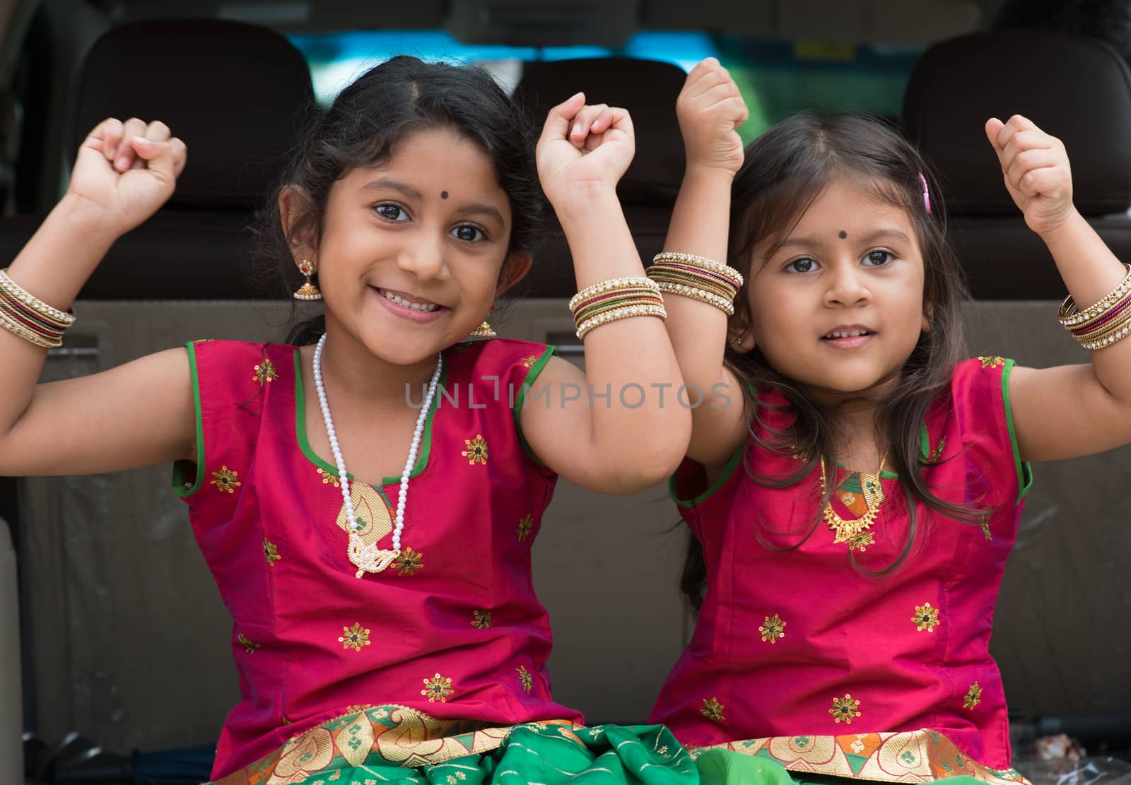 Indian girls sitting in car  by szefei