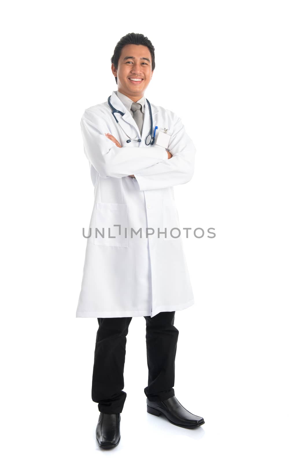 Full body of southeast Asian male medical doctor smiling, standing isolated on white background. Young man model.