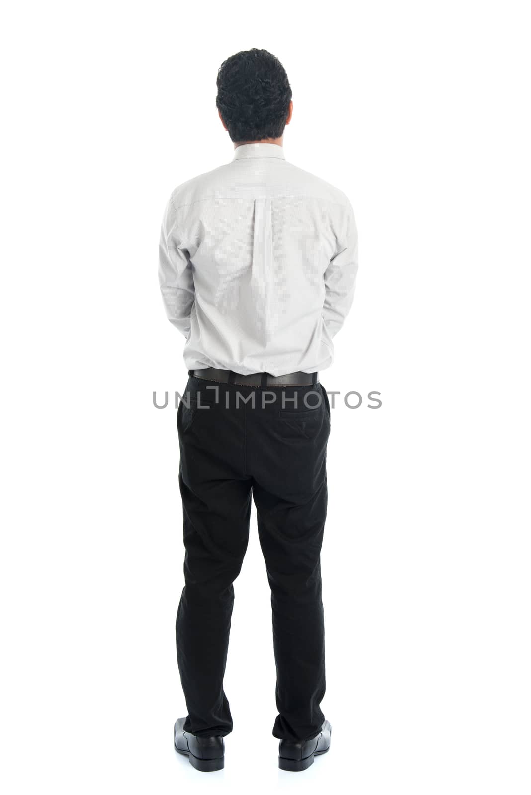 Full body rear view of Asian young male in casual business attire, standing isolated on white background.