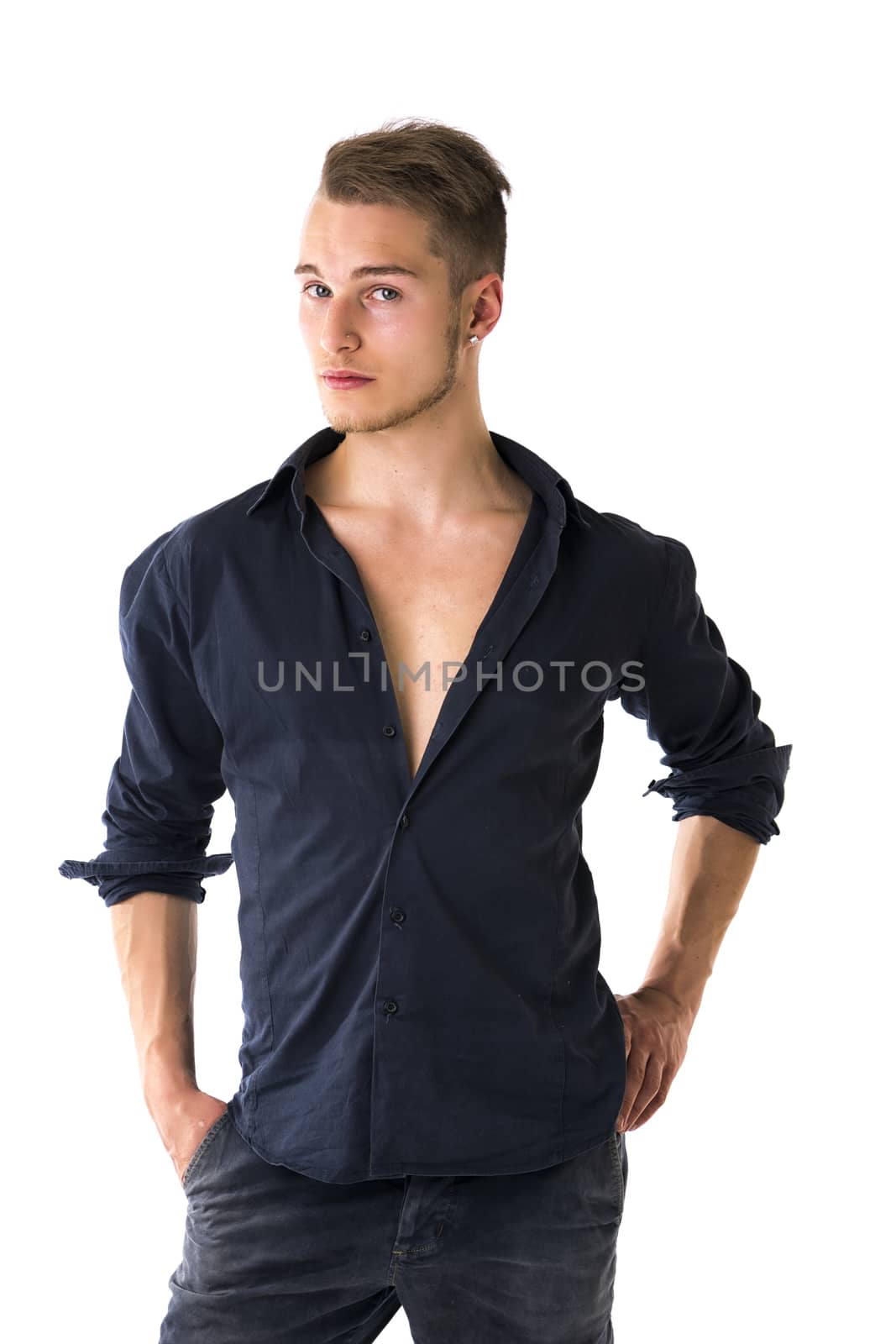 Cool confident blond young man with blue shirt and jeans, isolated on white