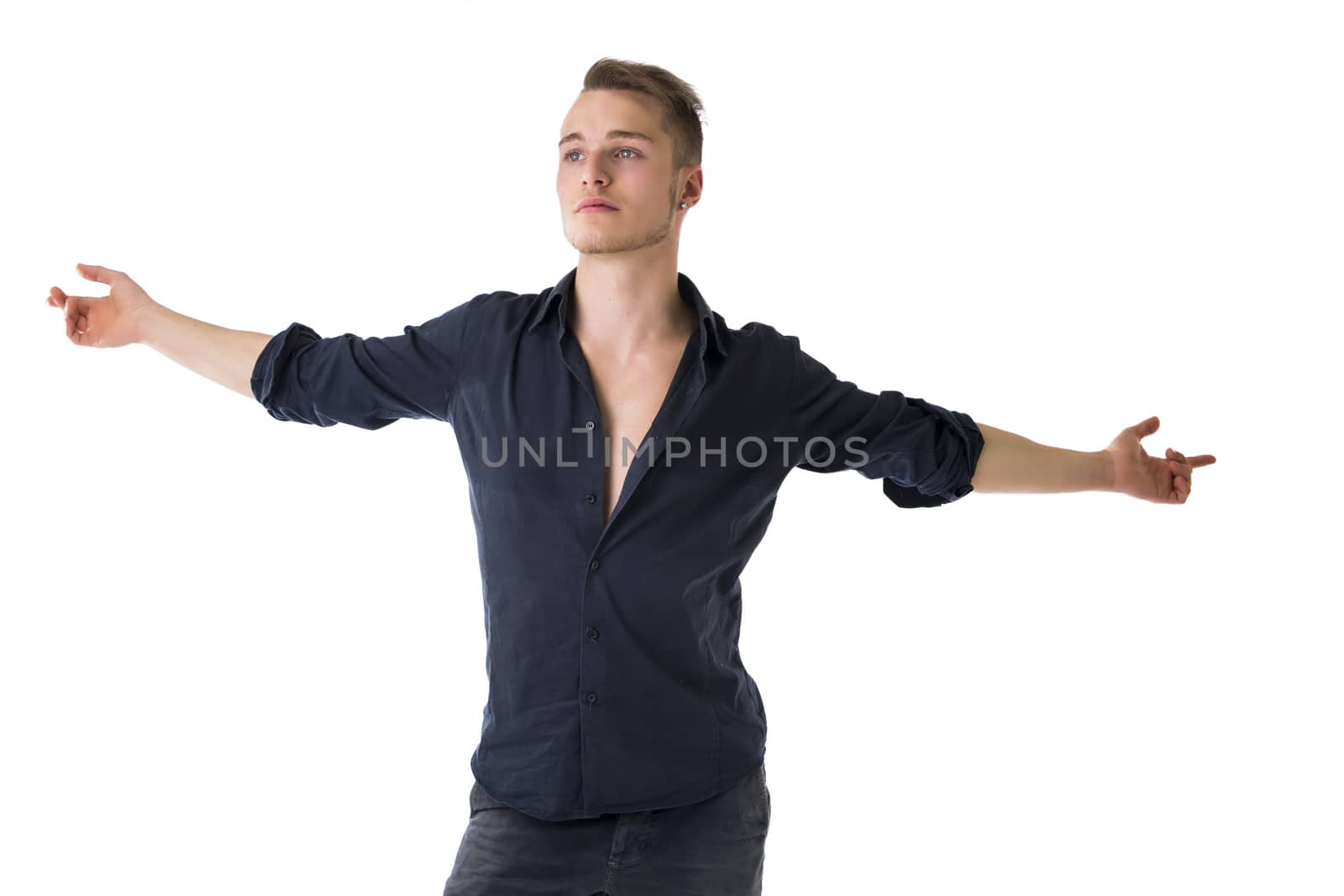 Handsome blond young man with arms spread open by artofphoto
