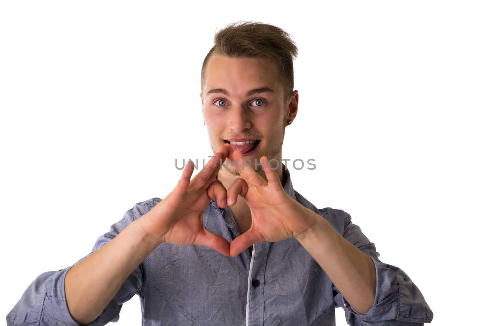 Happy blond young man doing heart or love sign with hands isolated on white