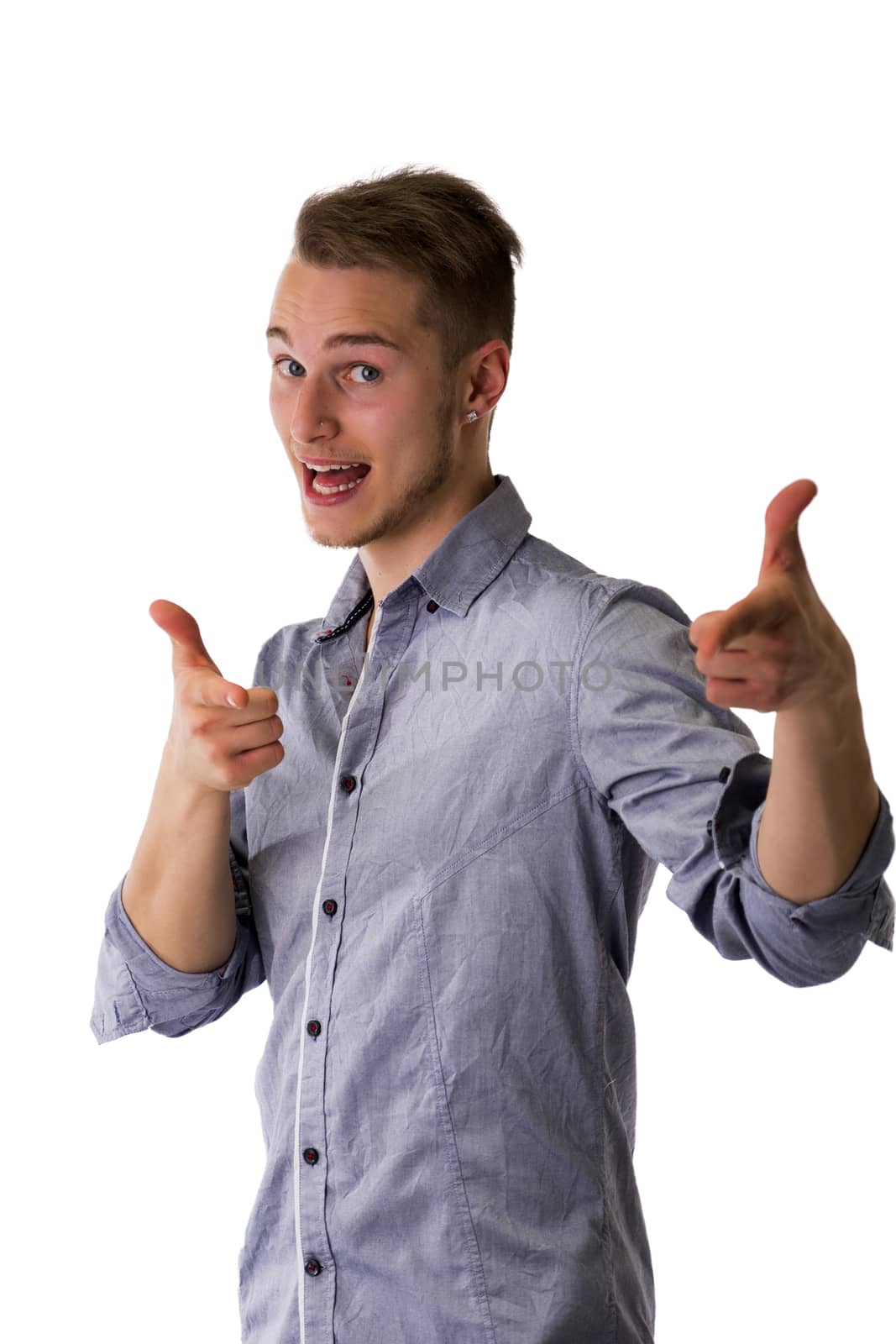 Happy attractive young man pointing fingers at camera with cool gesture
