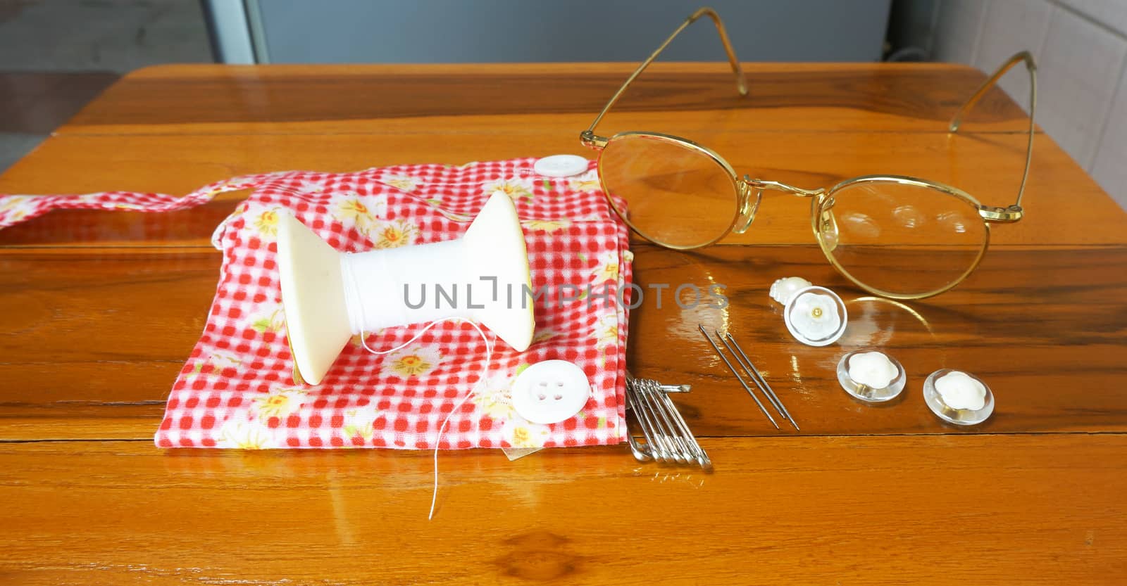 Sewing needles Including , thread, buttons, brooches and wear glasses to see clearly.                               