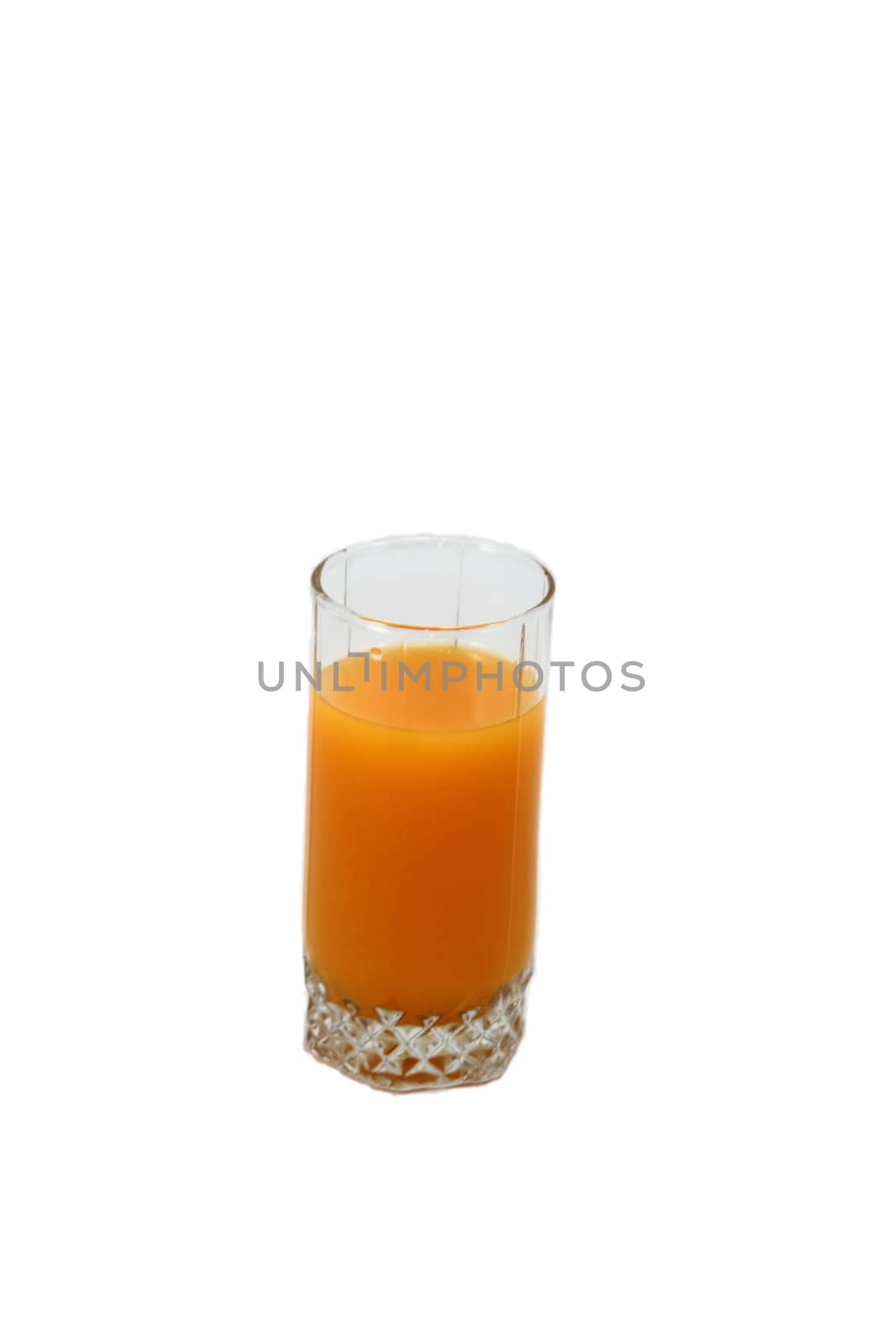 Standing on a white background glass of orange juice