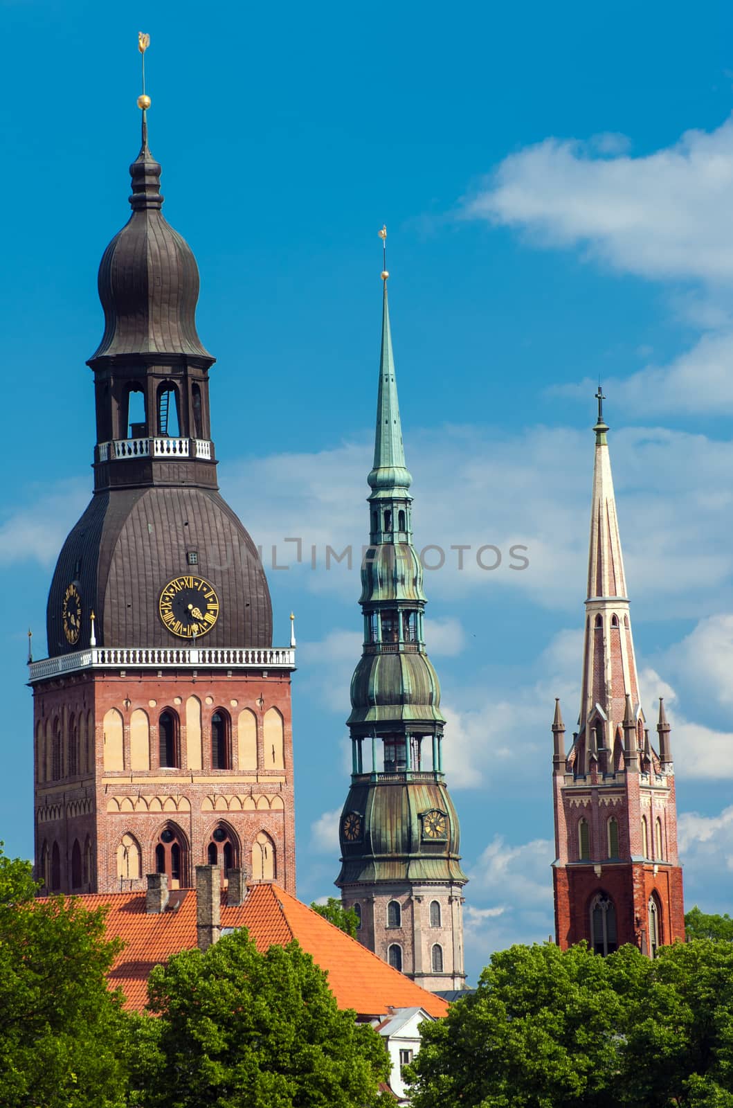  Three church towers in the picture are the Riga Dome cathedral,  St. Saviour's Church and St. Peter's church.