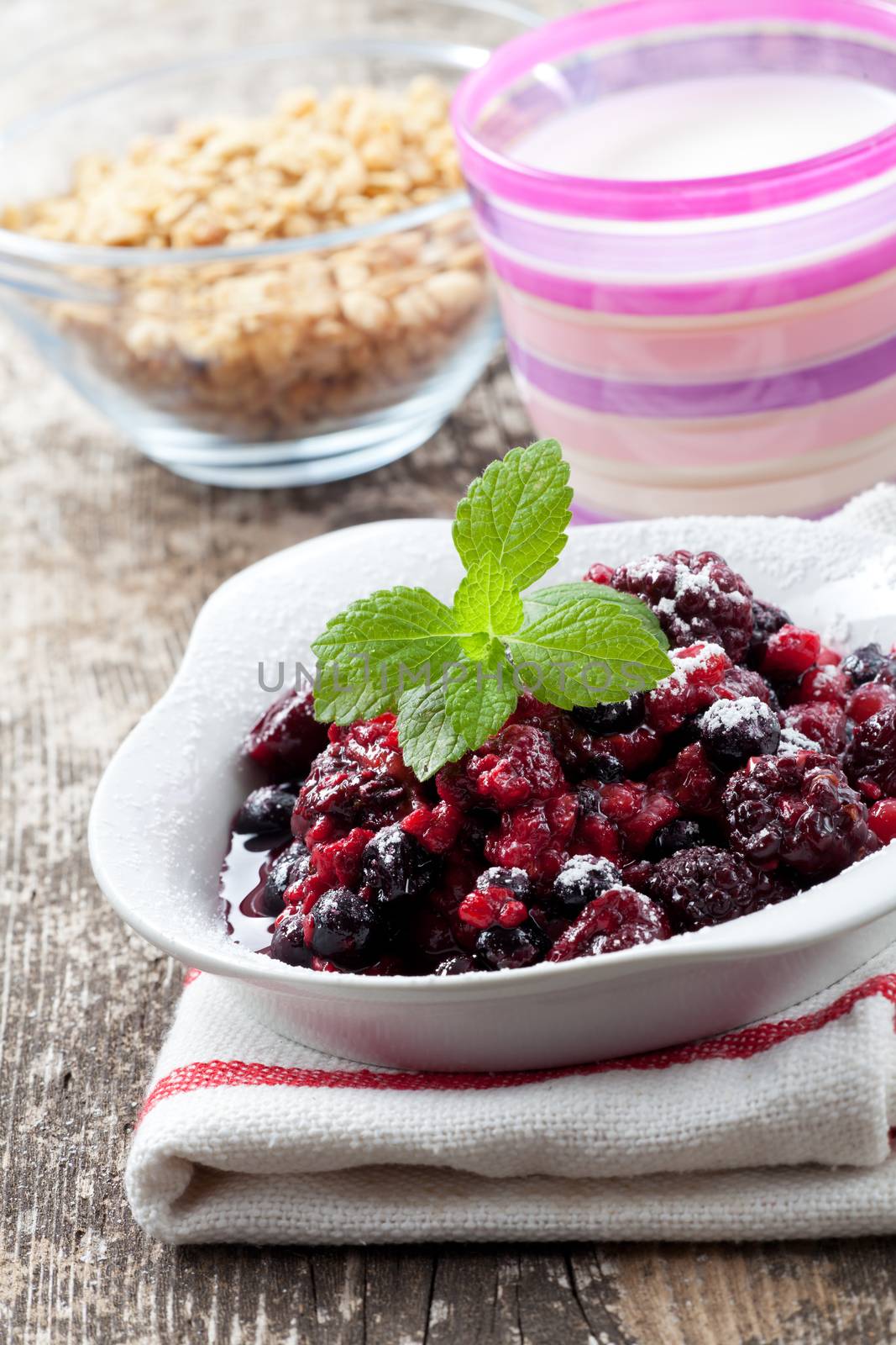 closeup of breakfast cereals with fruits and yoghurt by bernjuer