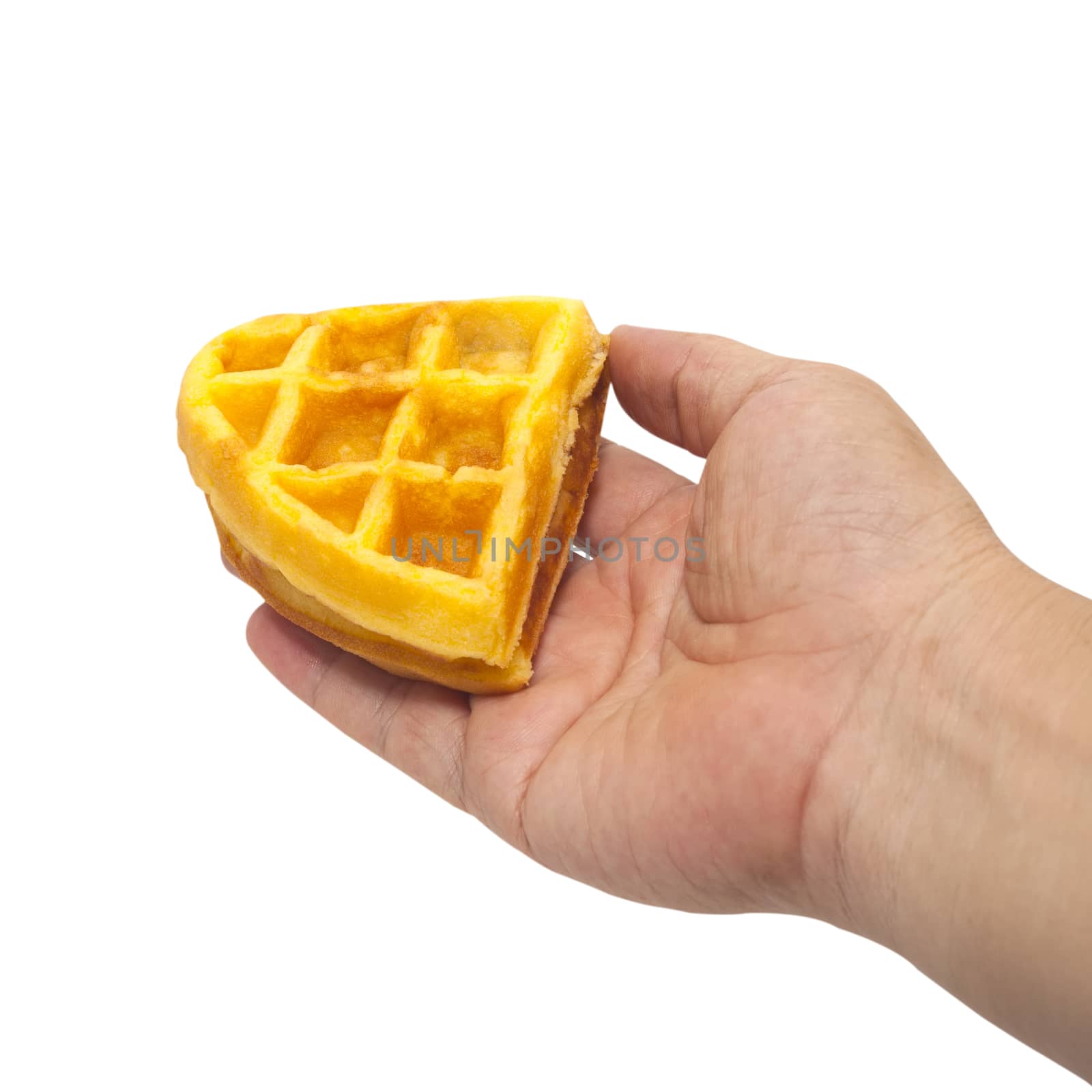 waffle in hand on white background