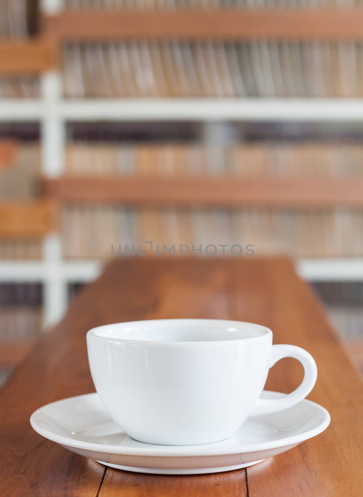 Coffee cup on wooden table by punsayaporn