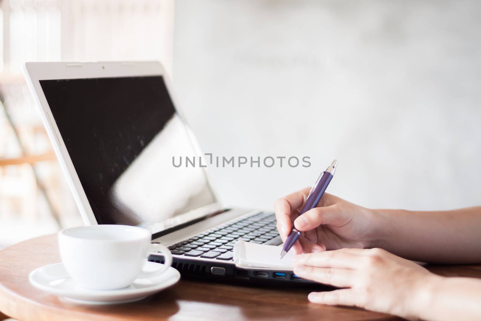 Closeup woman working in coffee shop, stock photo