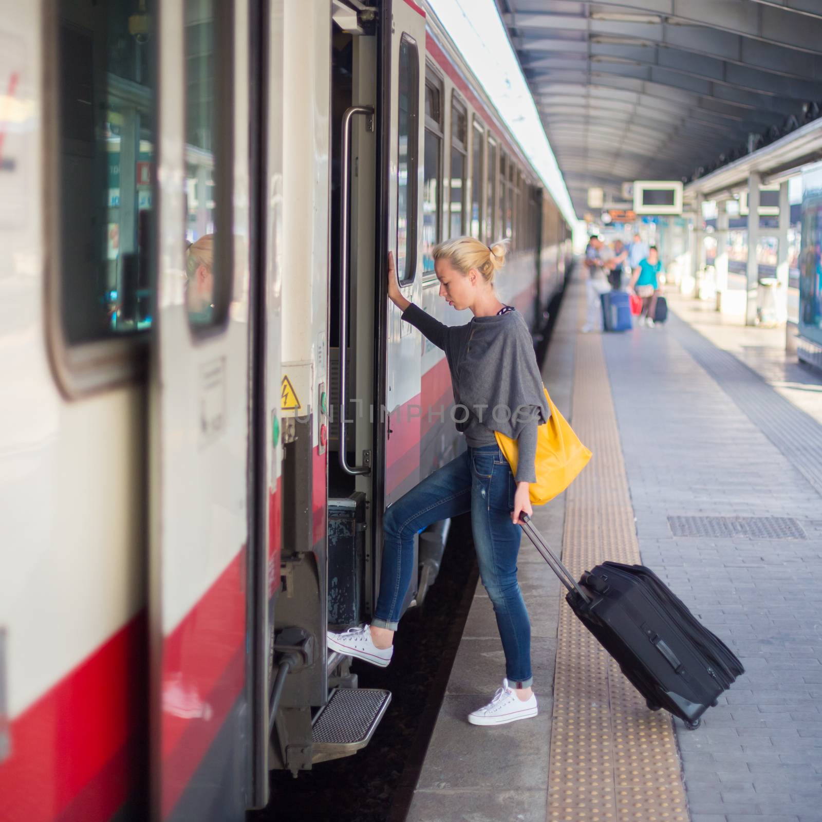 Lady waiting at the railway station. by kasto