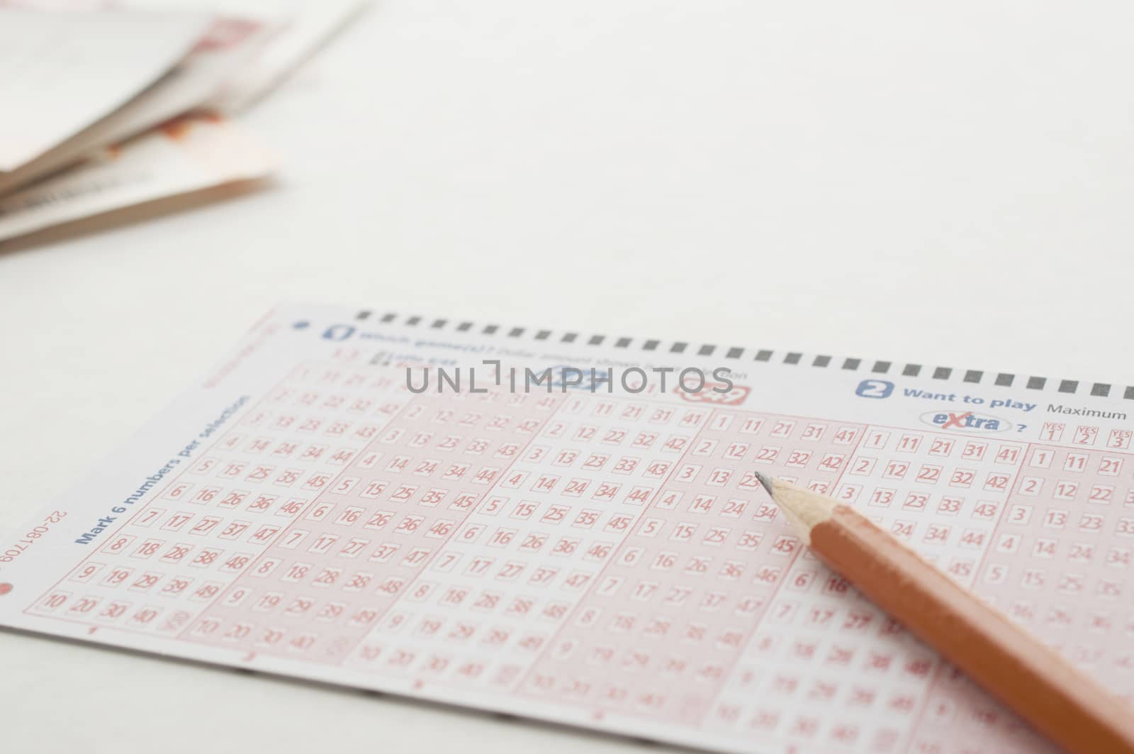 Coquitlam BC Canada - May 31, 2014 : Close up pen on lottery ticket. The British Columbia Lottery Corporation has  provided government sanctioned lottery games in British Columbia since 1985. 