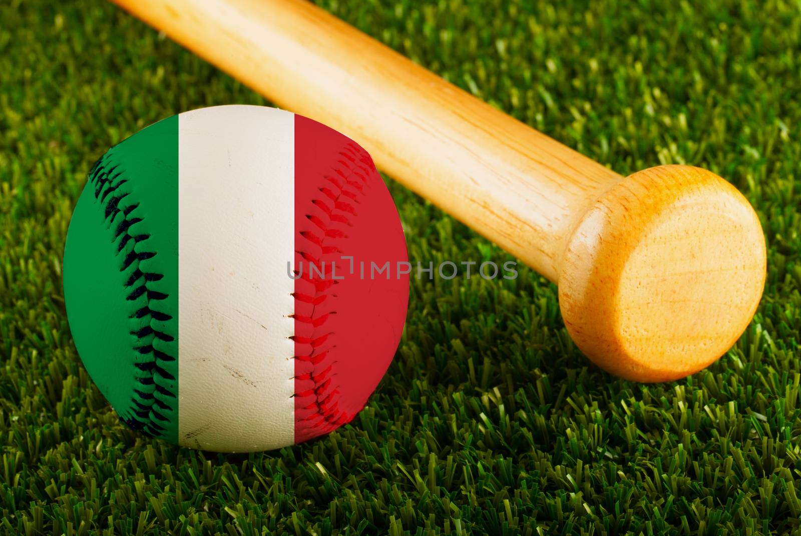 Baseball with Italy flag and bat over a background of green grass