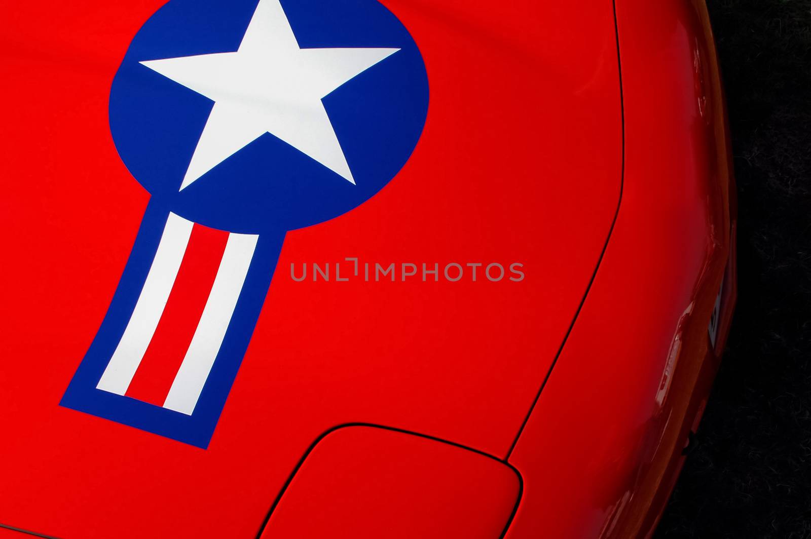 red sportscar from the USA with star insignia