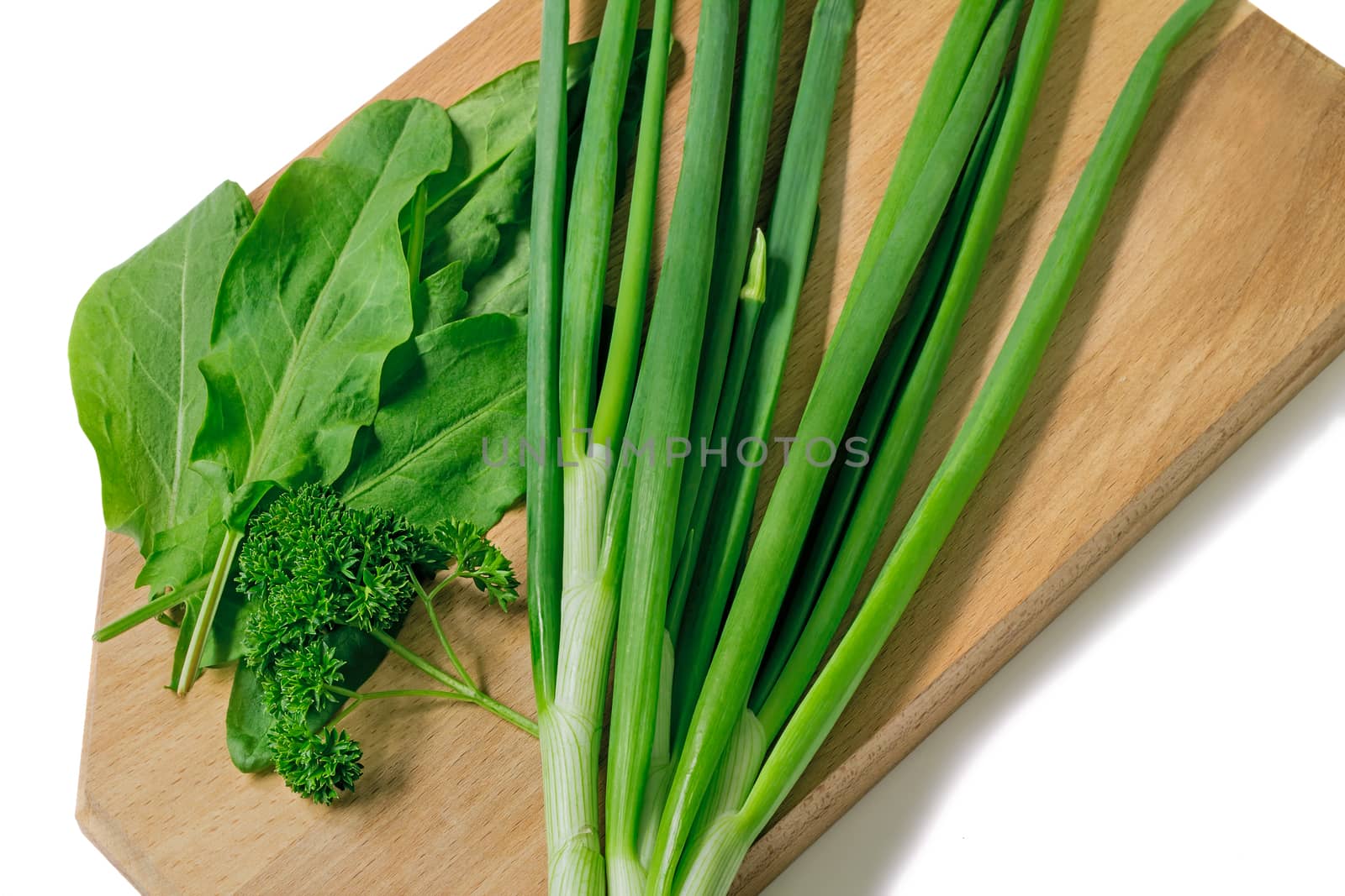 Leaves of parsley, green onions and ����������. Are presented on a white background.