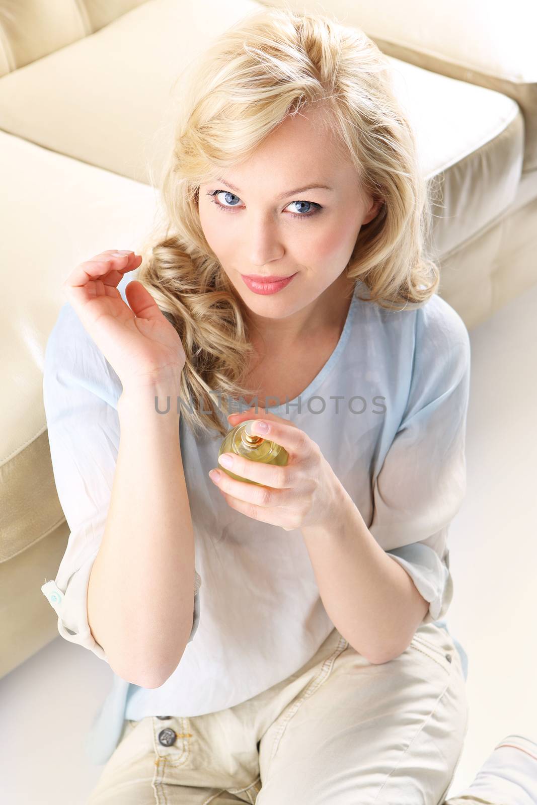 Beautiful smell- woman test perfume on her wrist. by robert_przybysz