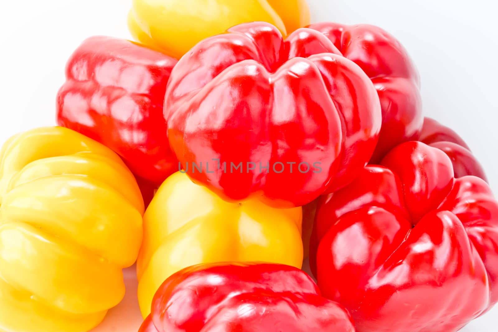 Photo of red and yellow raw pepper
