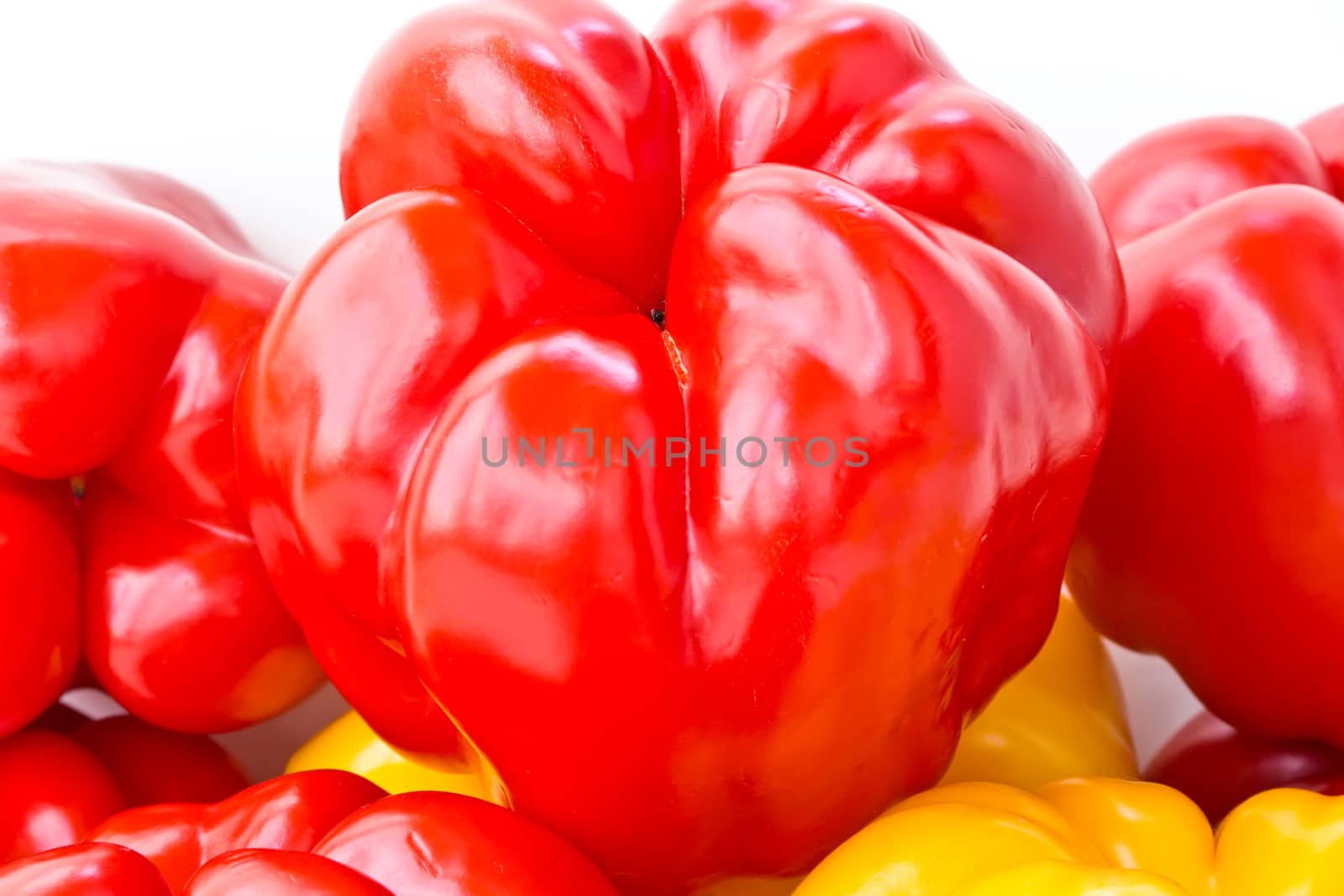 Photo of red and yellow raw pepper