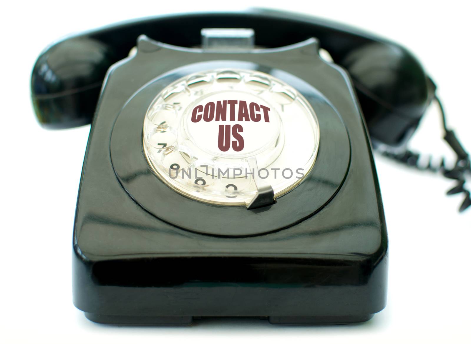 Vintage telephone over a white background