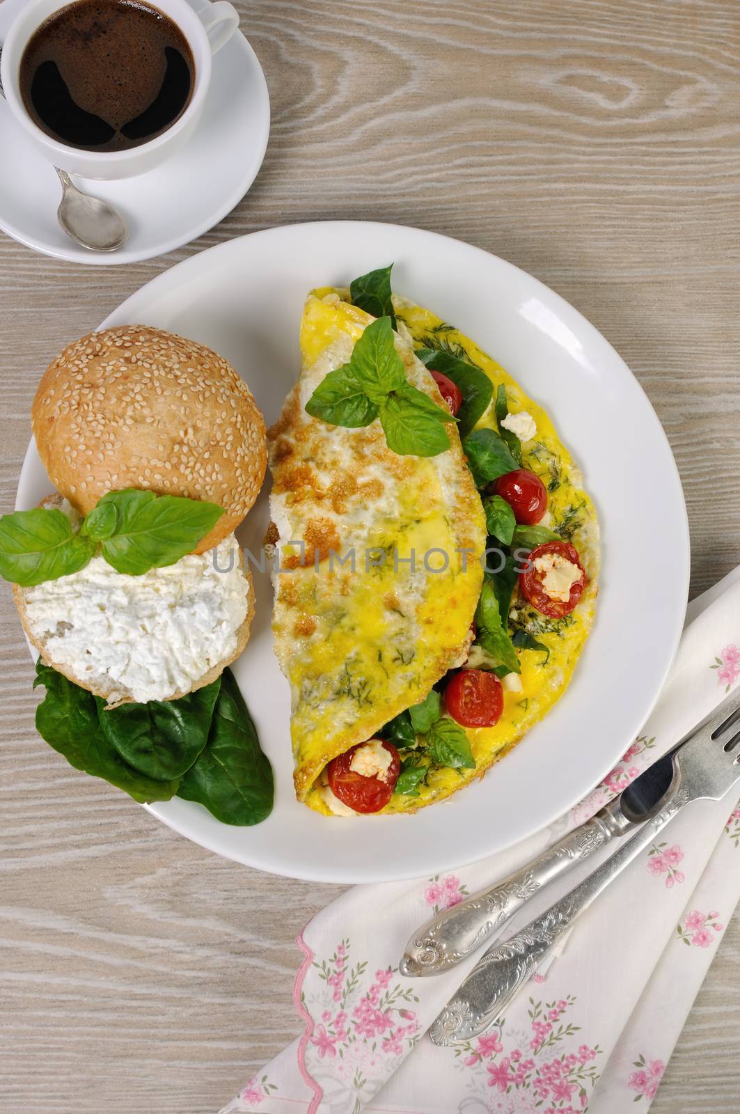 Omelet with spinach, basil, dill, cherry tomatoes and cheese Adyg