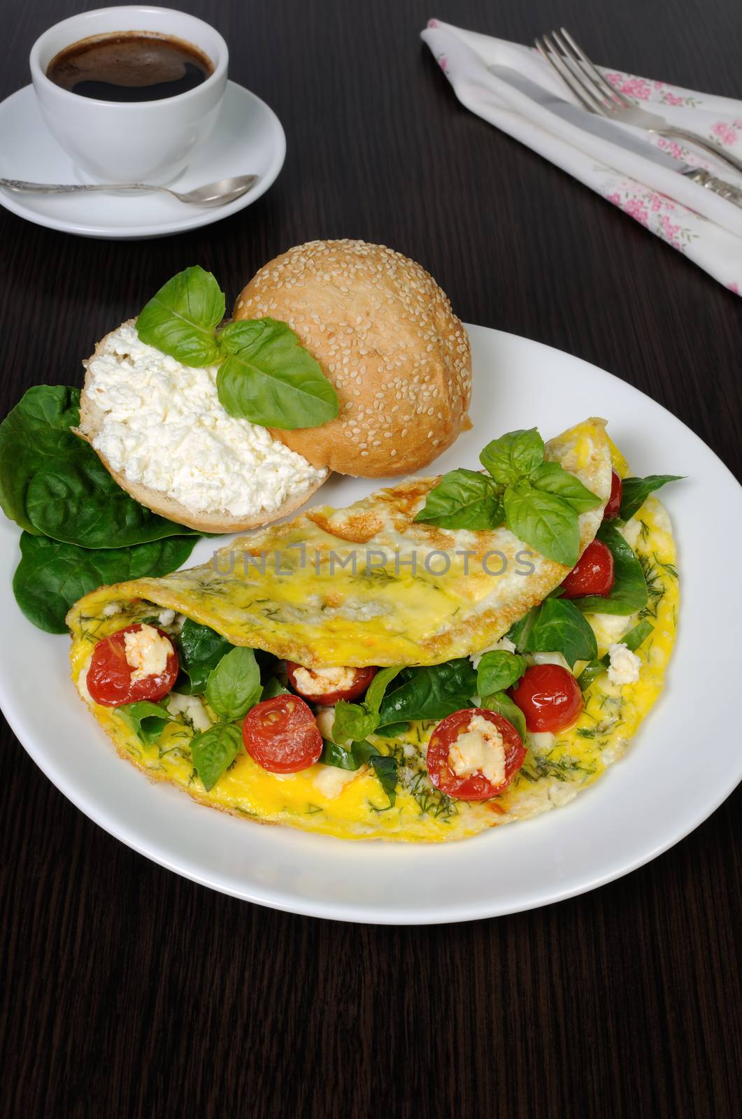 Omelet with spinach, basil, dill, cherry tomatoes and cheese Adyg