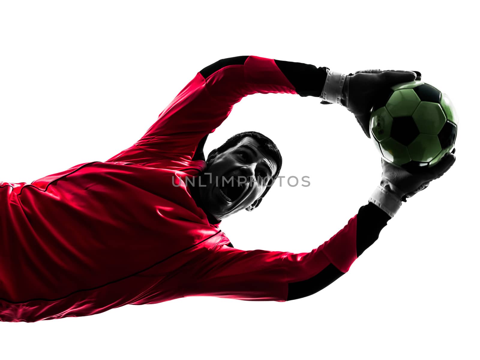 one caucasian soccer player goalkeeper man catching ball in silhouette isolated white background
